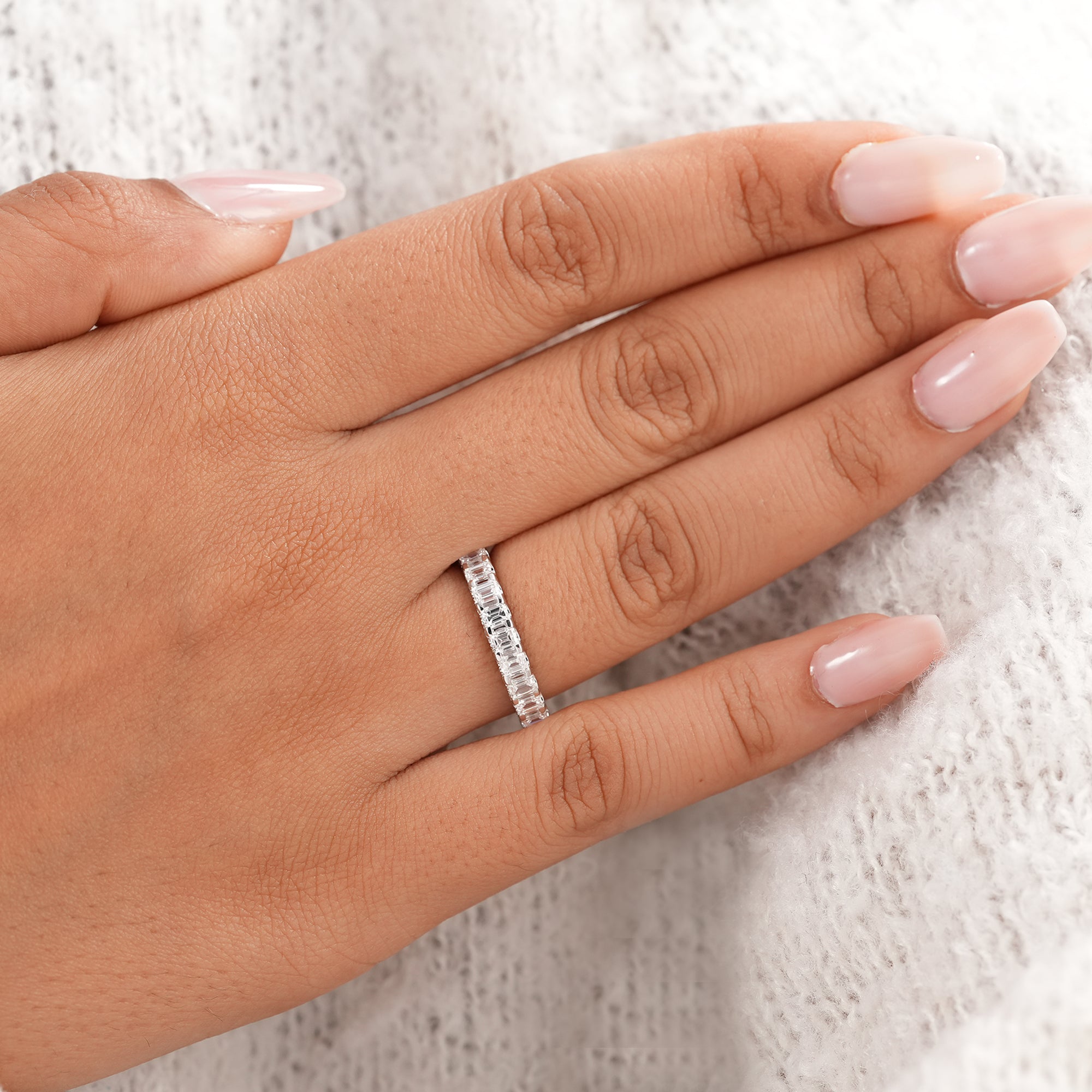 Women's emerald cut diamond eternity band for weddings and anniversaries