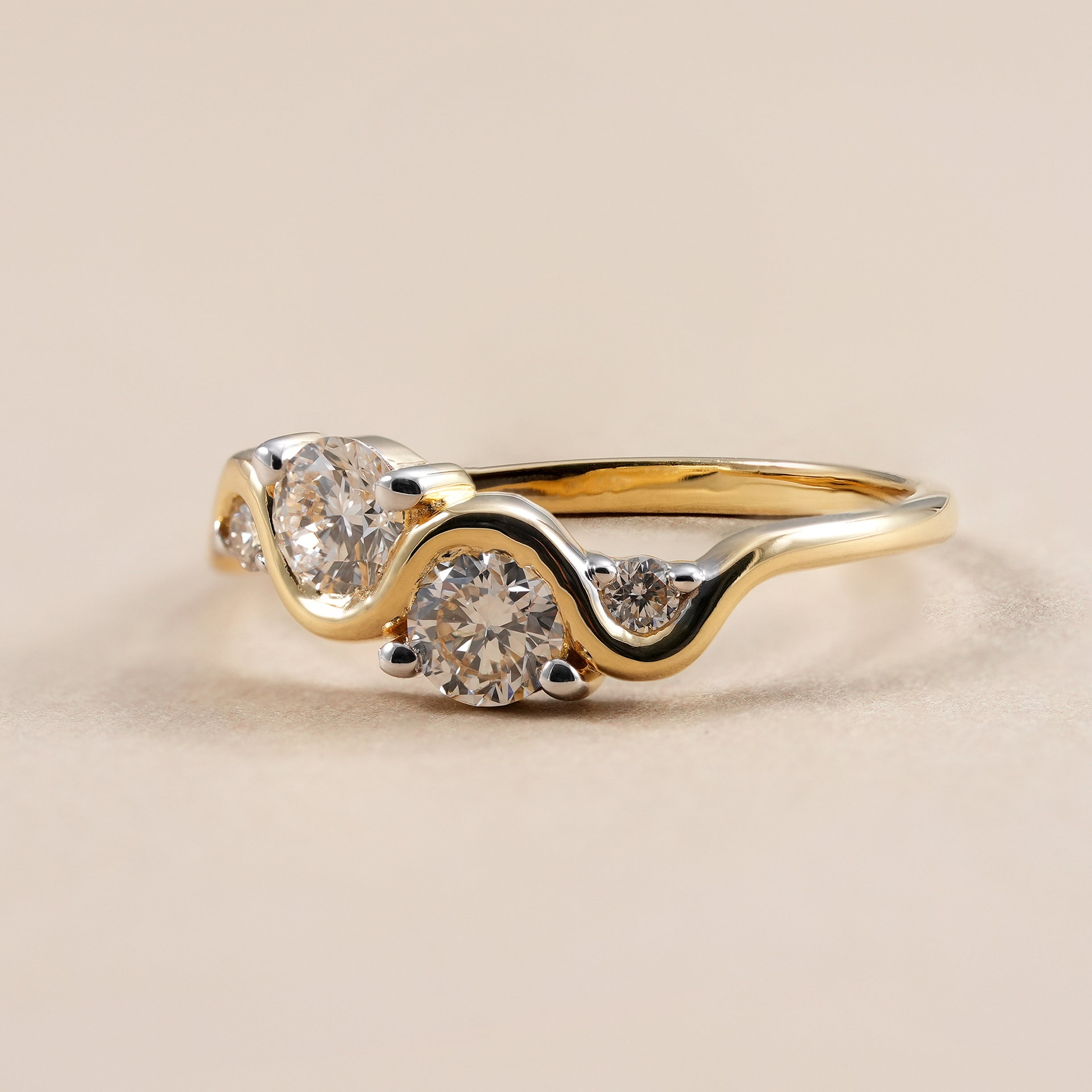 Curved lab grown diamond wedding band with round brilliant diamonds.