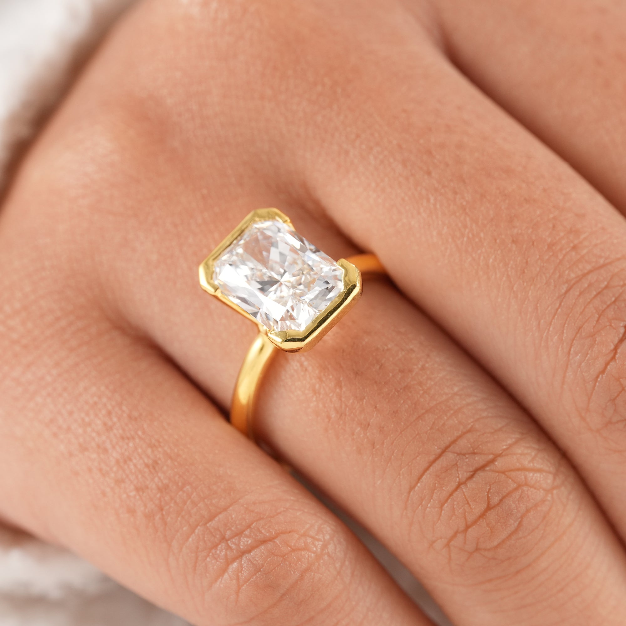 Classic radiant solitaire ring crafted in solid yellow gold.