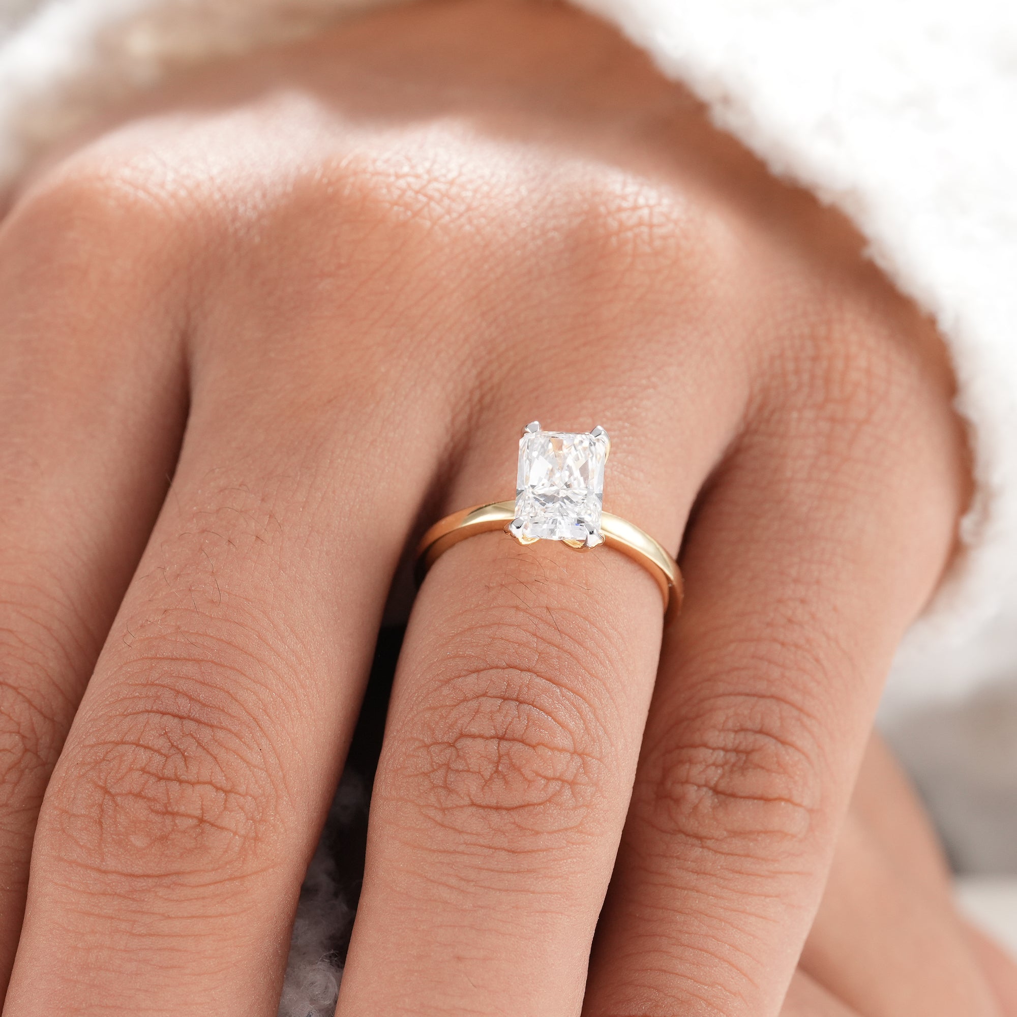 Ethical radiant diamond engagement ring in yellow gold.
