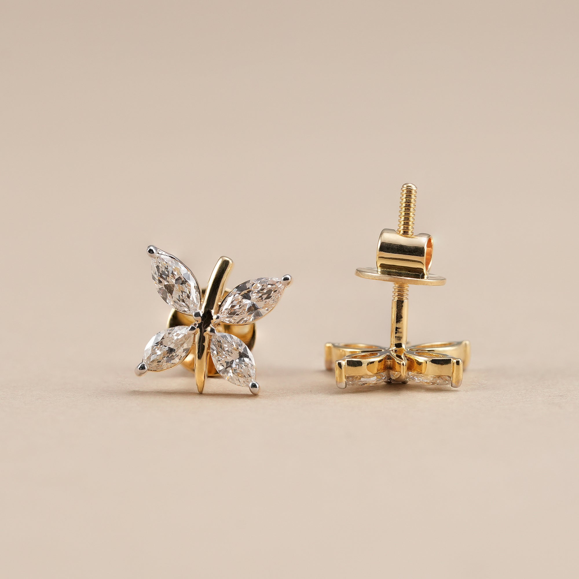 Elegant marquise diamond stud earrings with four stone floral design