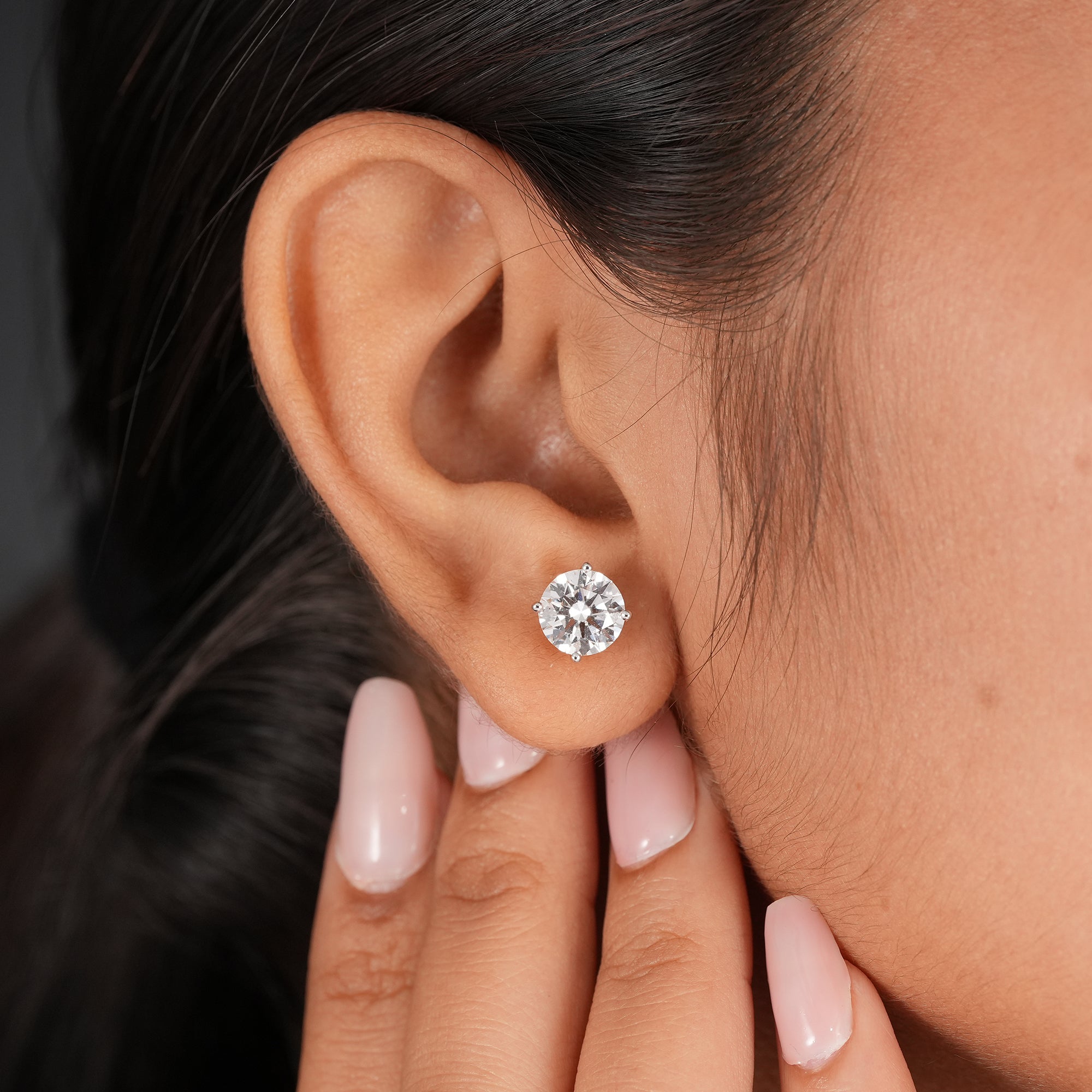 Minimalist round solitaire stud earrings with secure basket setting