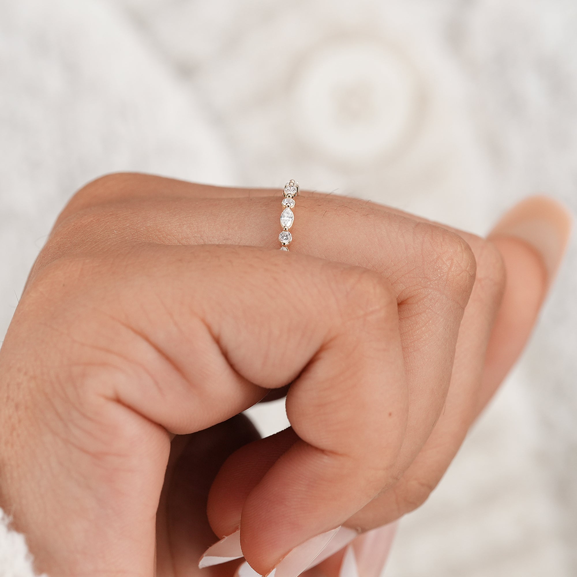 Delicate alternating diamond eternity ring in solid gold