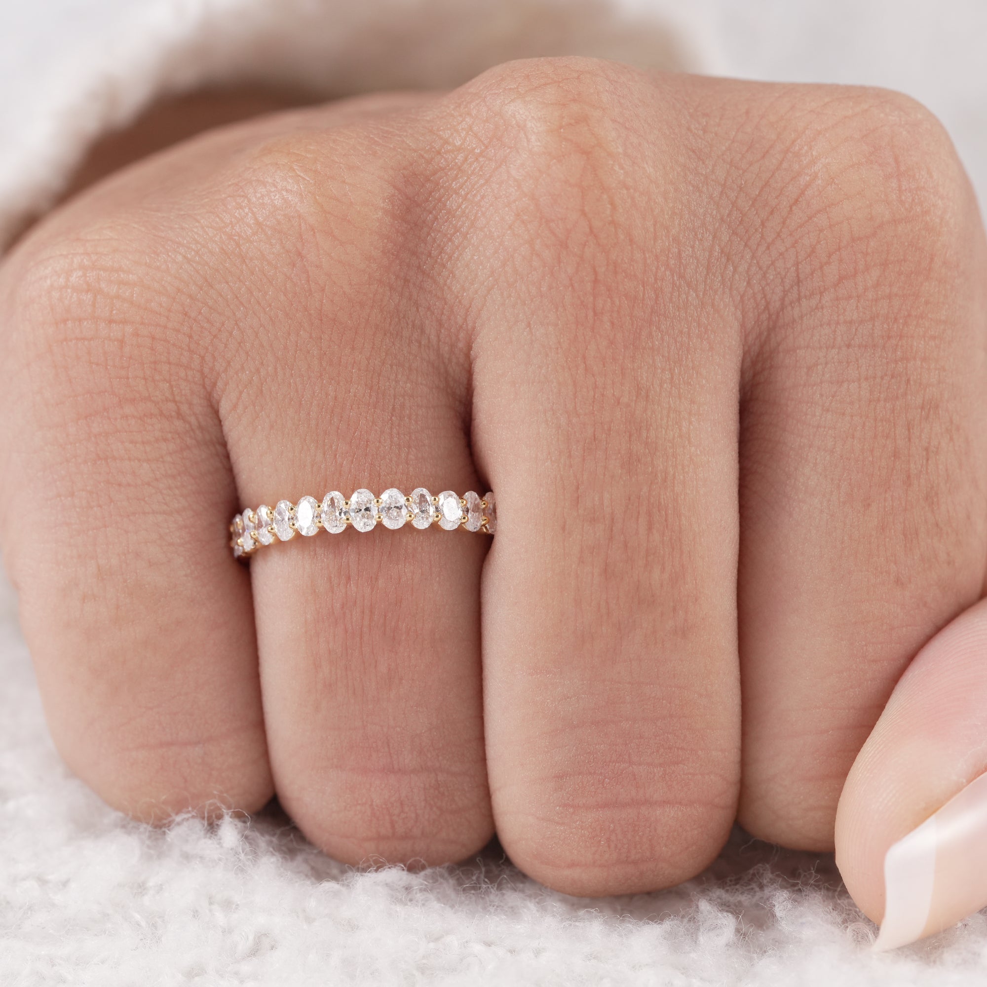Fine jewelry oval diamond anniversary band.