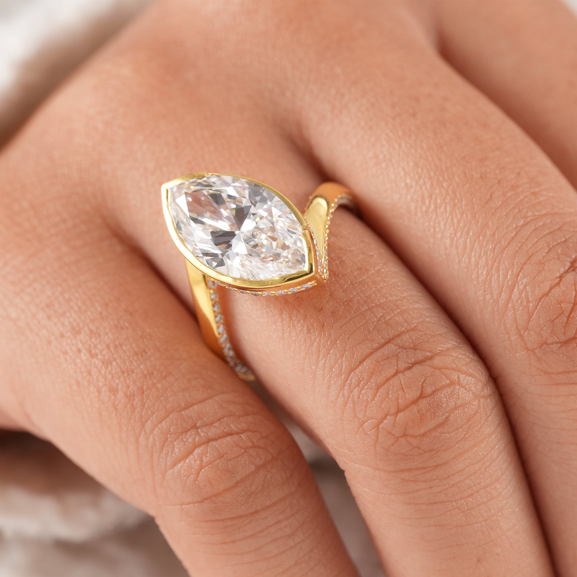 IGI certified bezel set marquise diamond proposal ring.