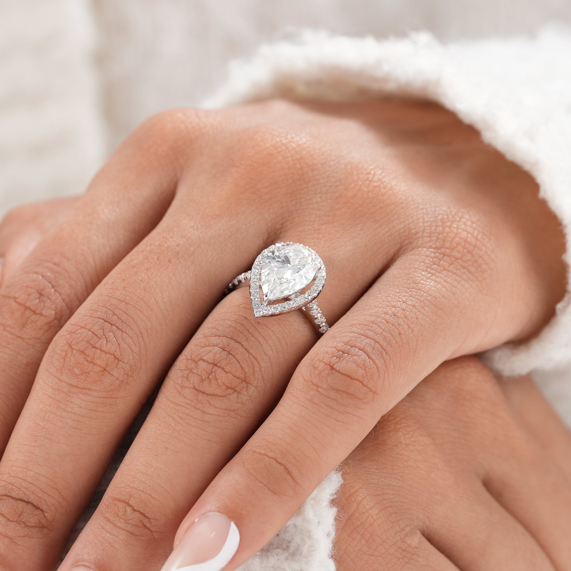 Bridal jewelry pear engagement ring with IGI certified diamond.