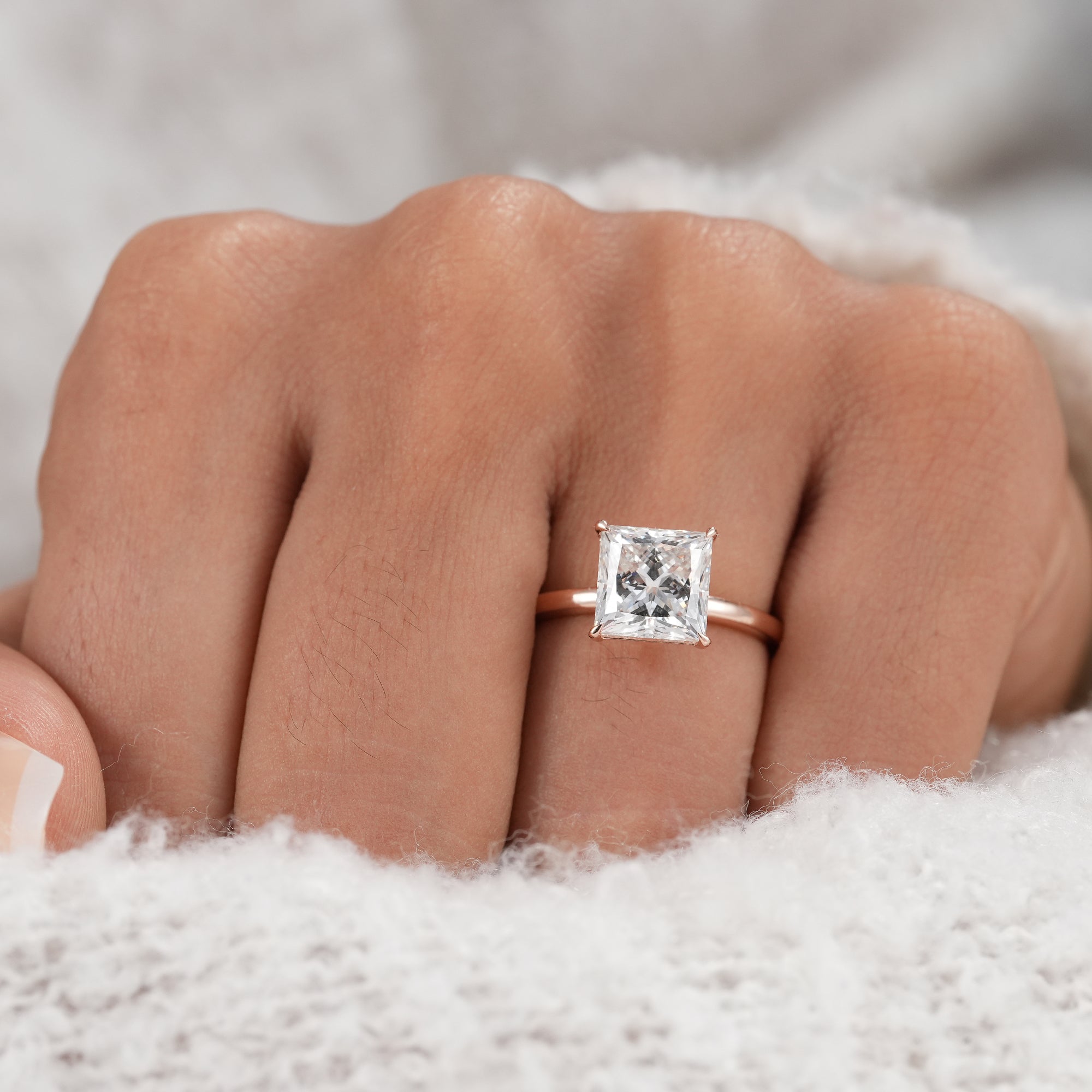 Classic solitaire princess diamond ring for bridal jewelry.