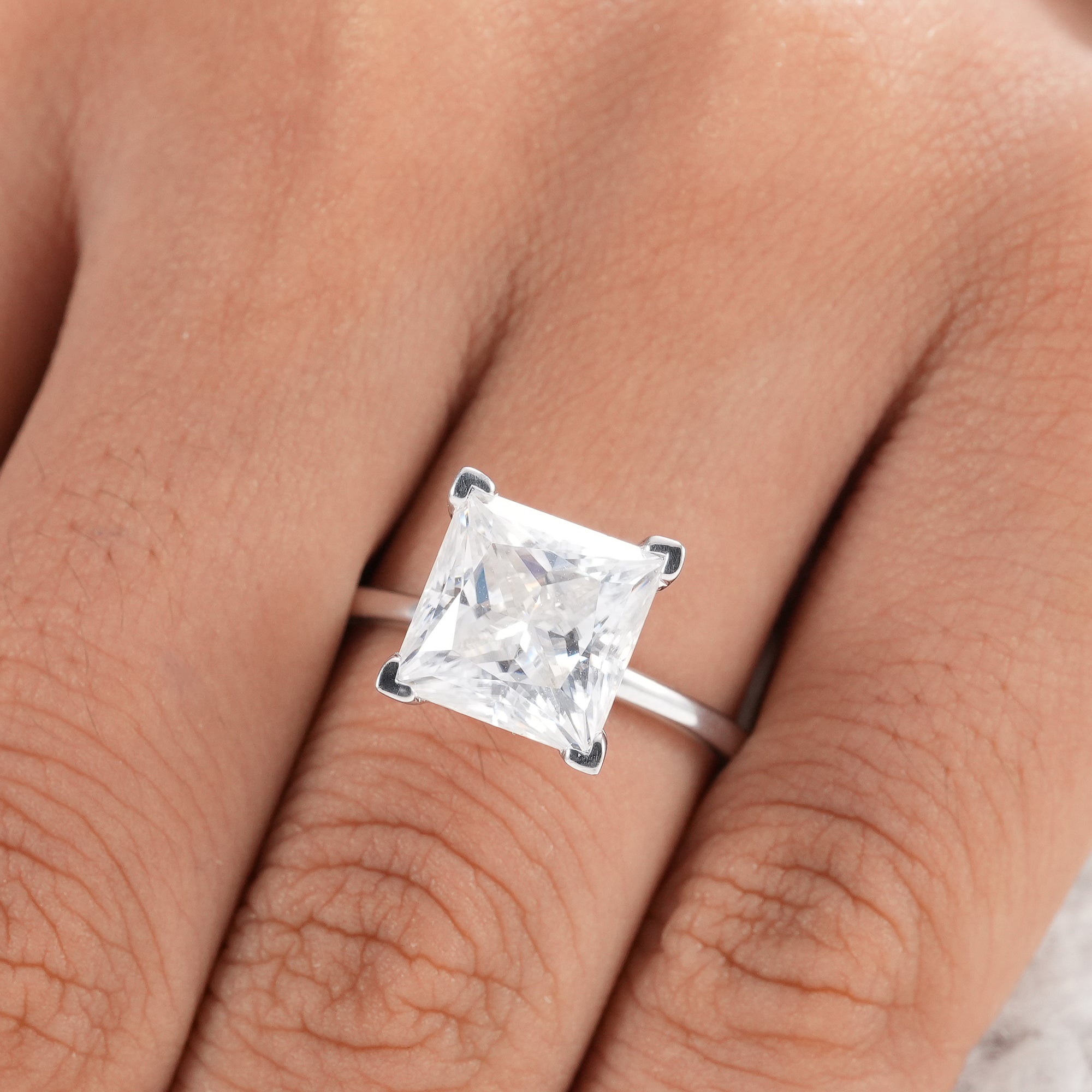 Handcrafted princess cut engagement ring with ethical diamond.