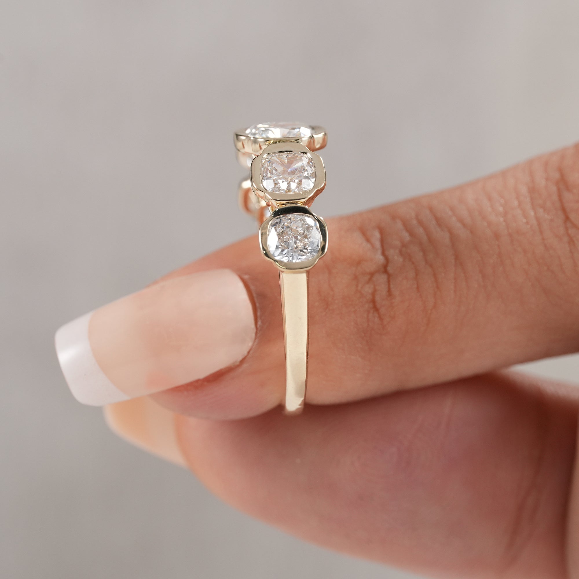 Bezel set lab diamond anniversary band in fine jewelry design.