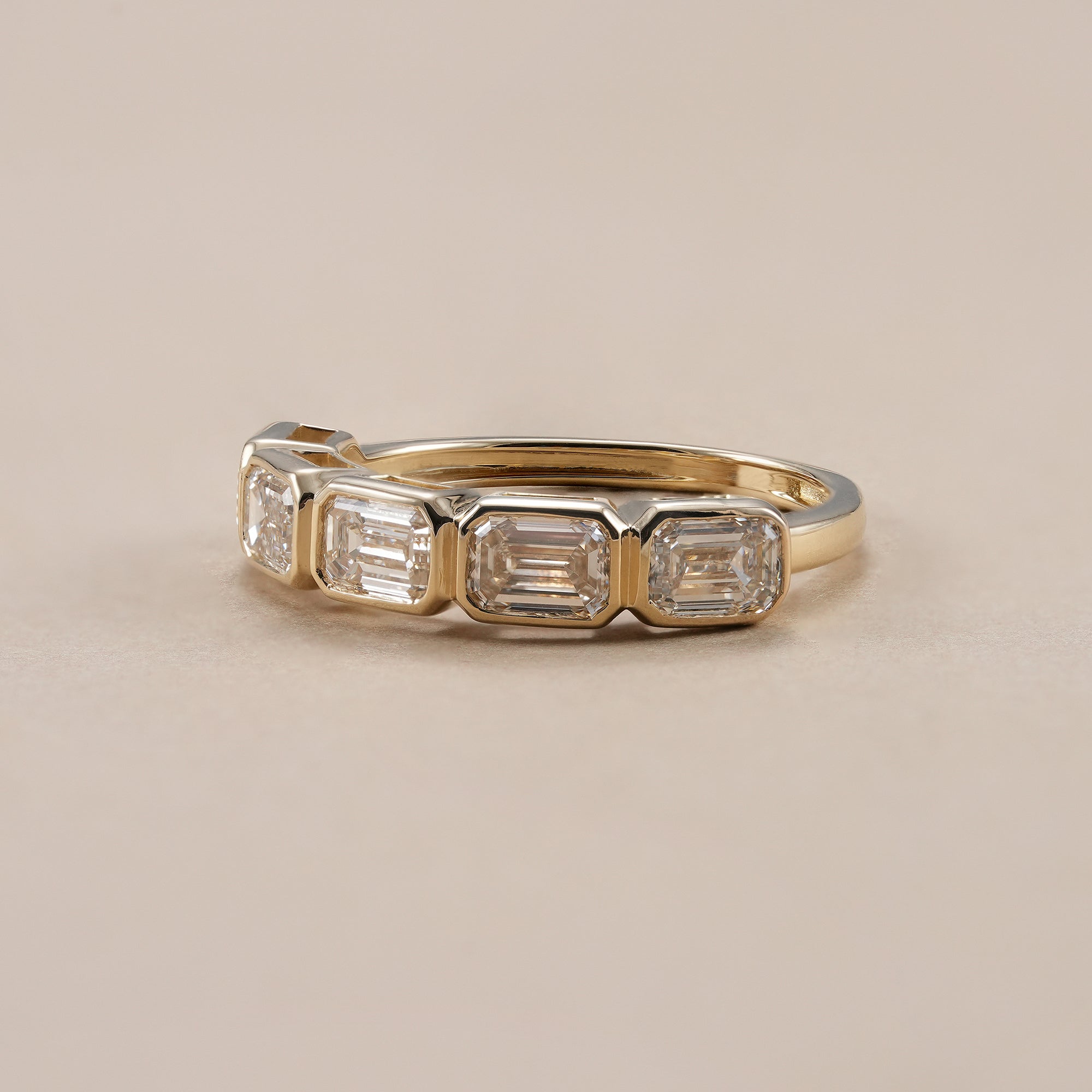 Lab grown diamond wedding band featuring emerald cut diamonds.