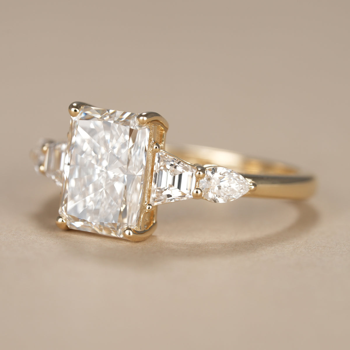 IGI certified radiant cut lab diamond five stone ring handcrafted for timeless elegance.