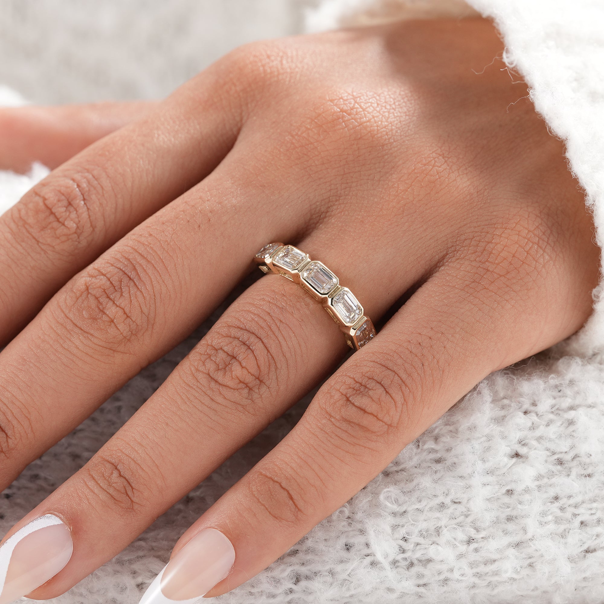 Stackable emerald cut diamond wedding ring.