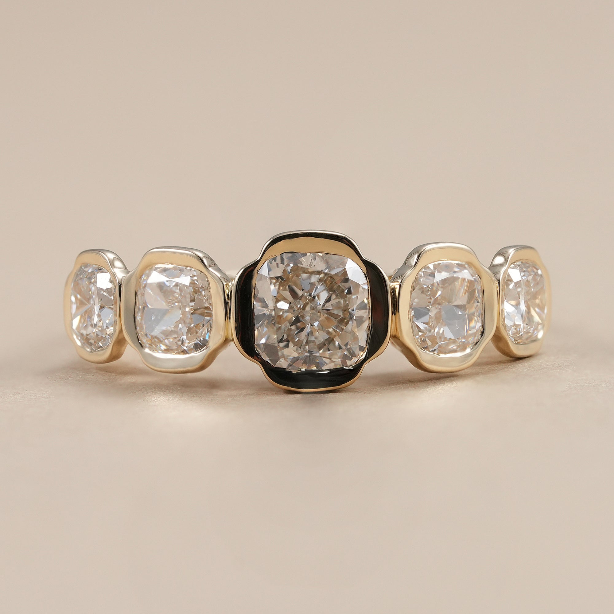 Five stone lab grown diamond wedding band with cushion cut diamonds.
