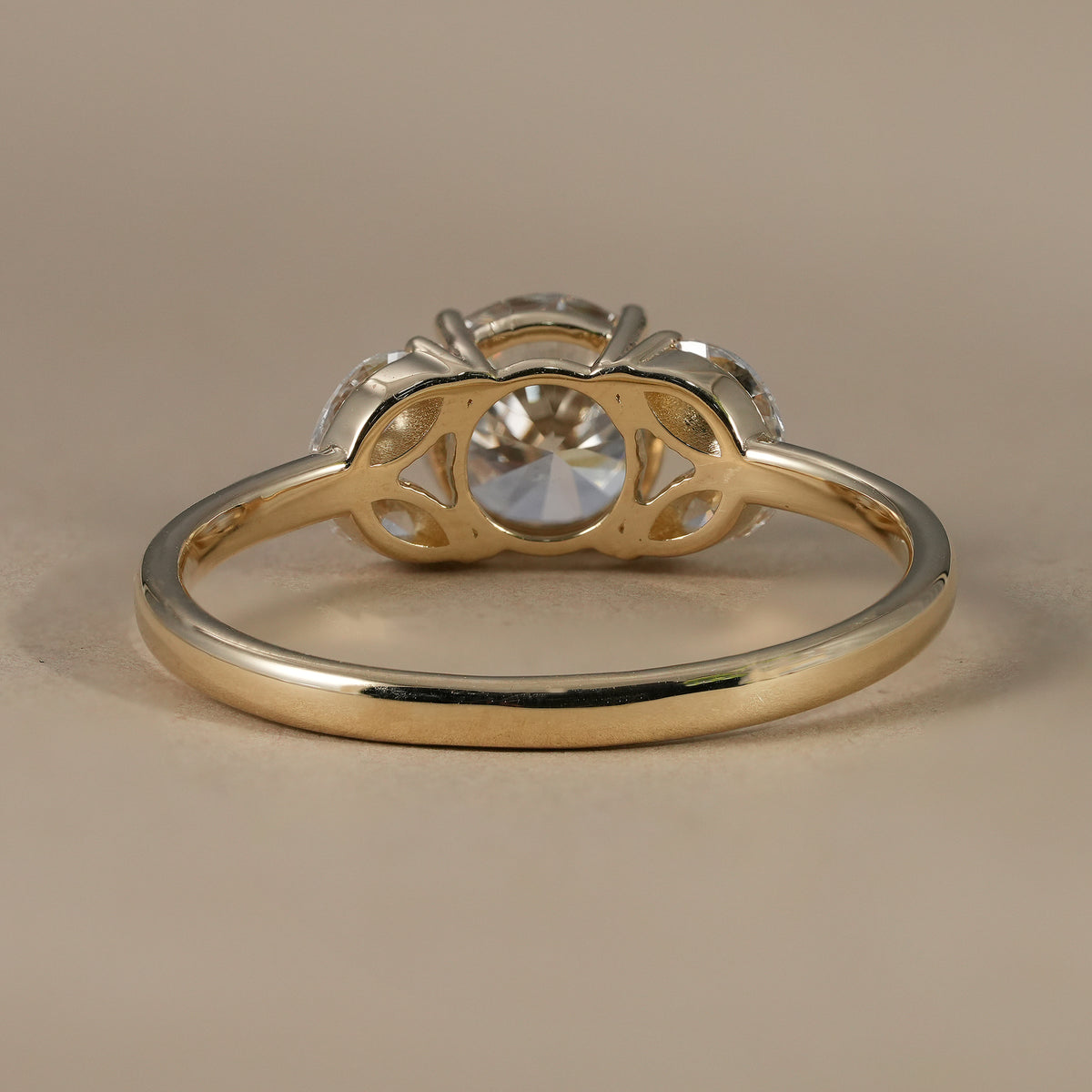 Luxury floral cluster ring with round center lab diamond and gold band.