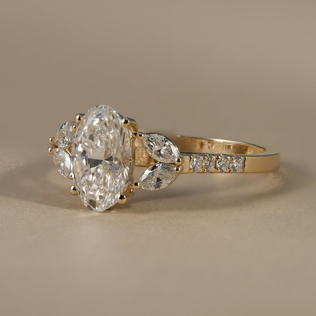 IGI certified 1.5 CT oval lab diamond ring featuring floral inspired marquise side stones.