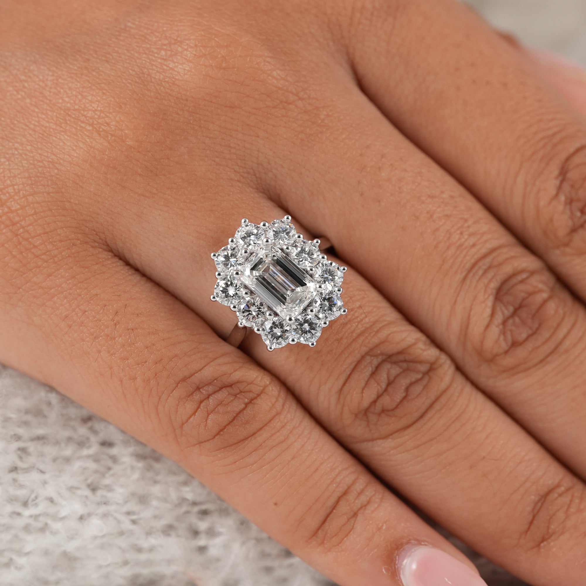 IGI certified emerald diamond halo ring in white gold