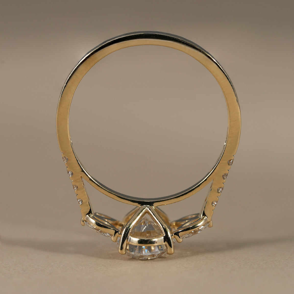 Floral cluster oval diamond ring with sparkling marquise side diamonds and pavé band.