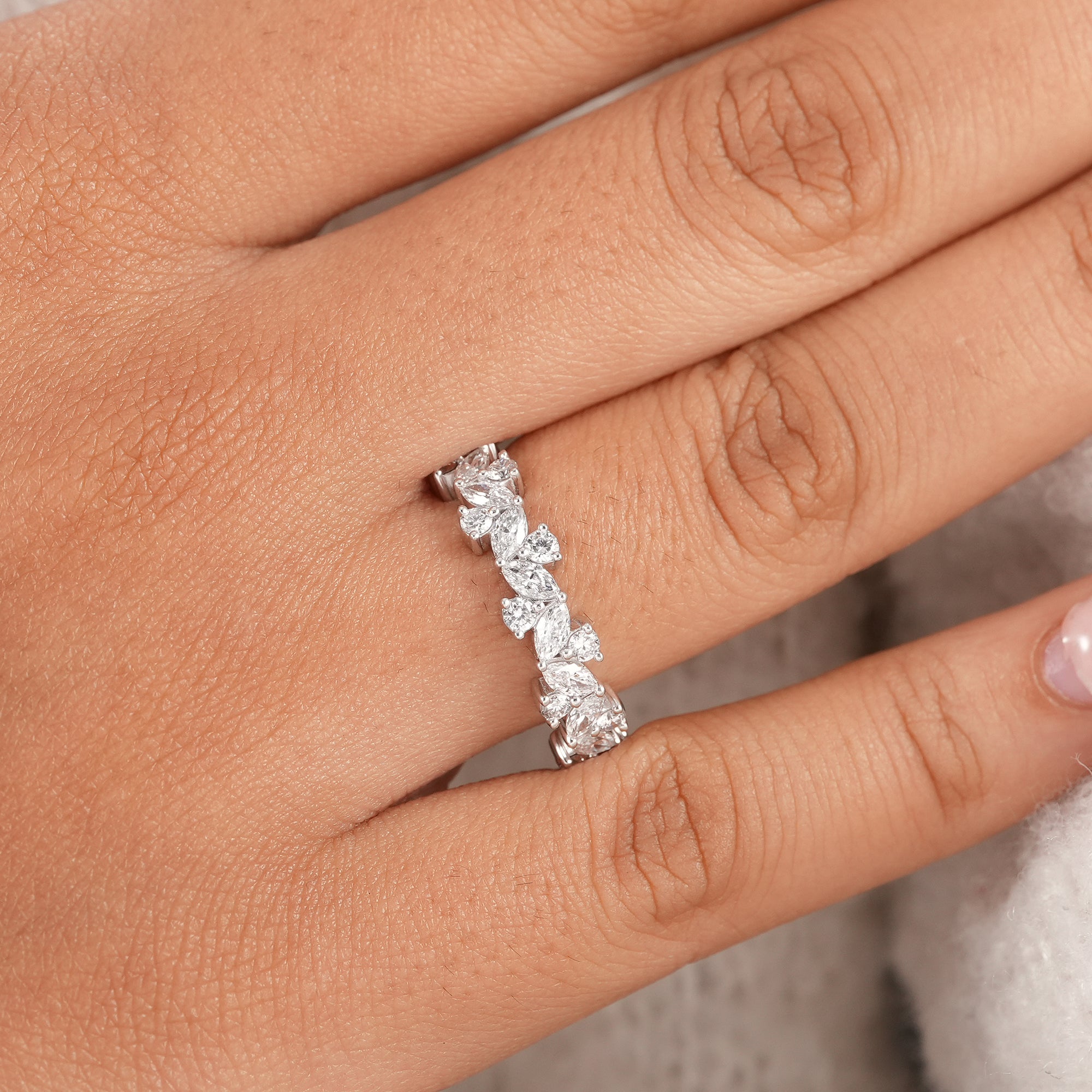 Elegant marquise diamond anniversary band with brilliant round diamonds.