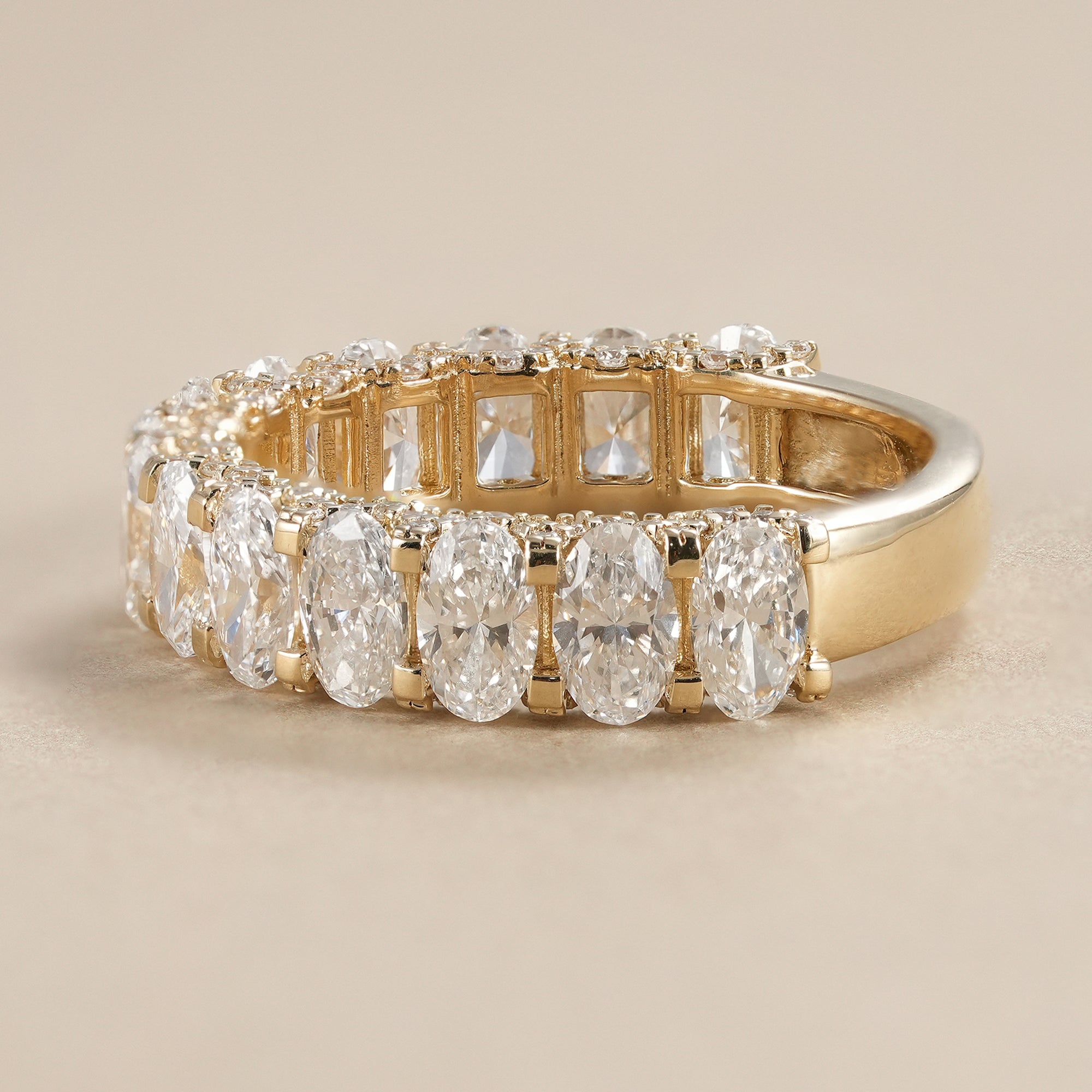 Luxury oval lab grown diamond wedding band handcrafted in solid yellow gold with brilliant diamonds.