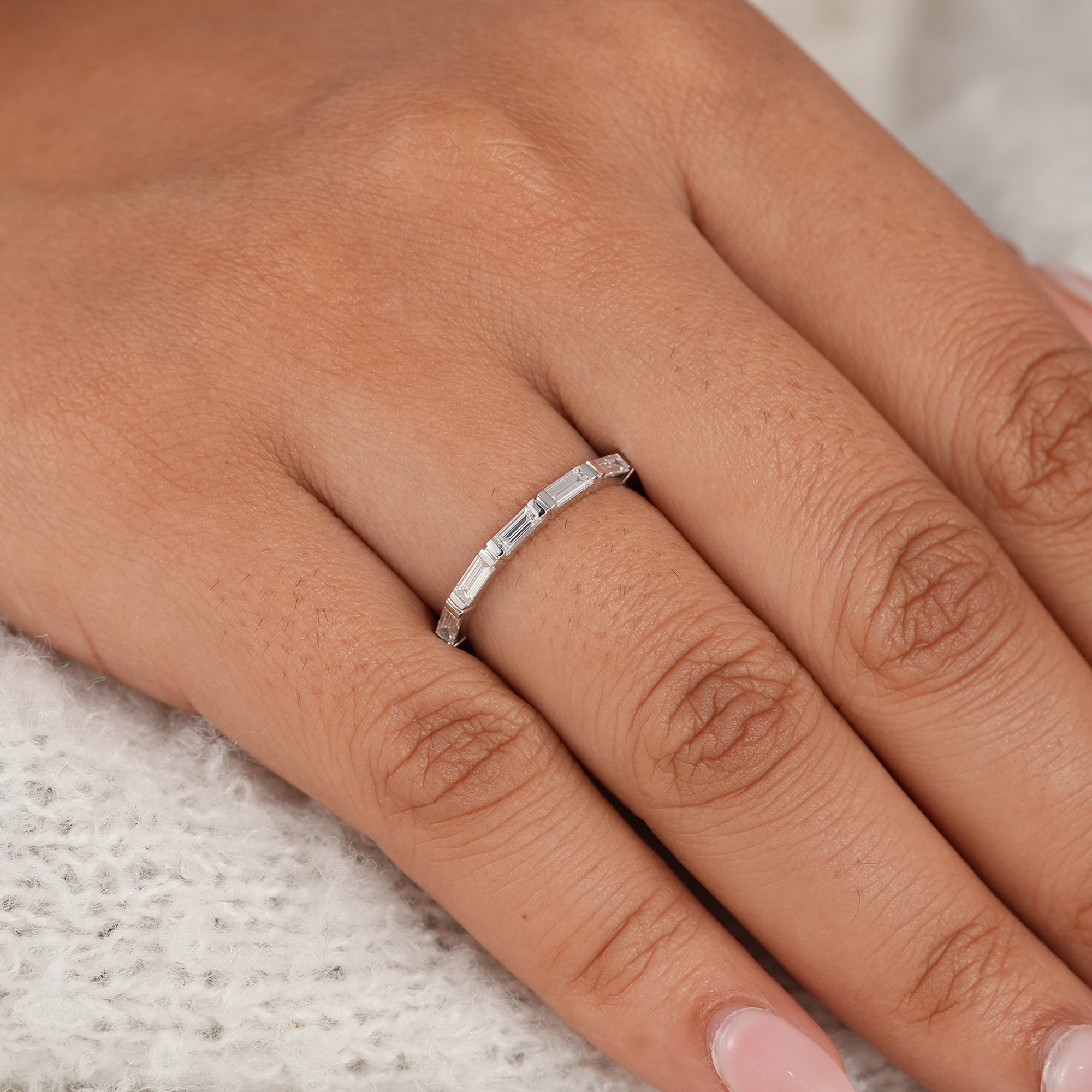Women's baguette diamond eternity ring with modern minimalist design