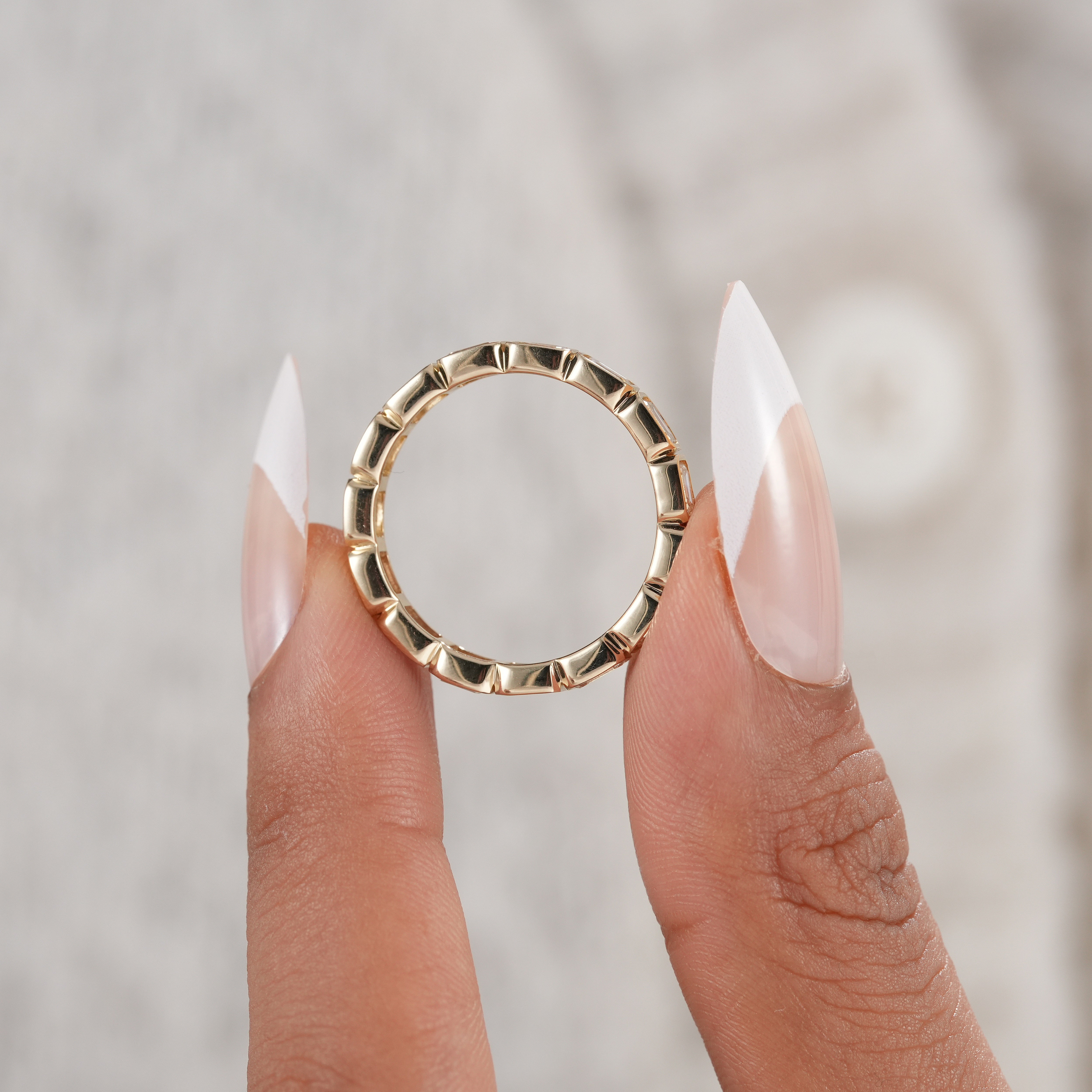 Contemporary emerald diamond wedding band.