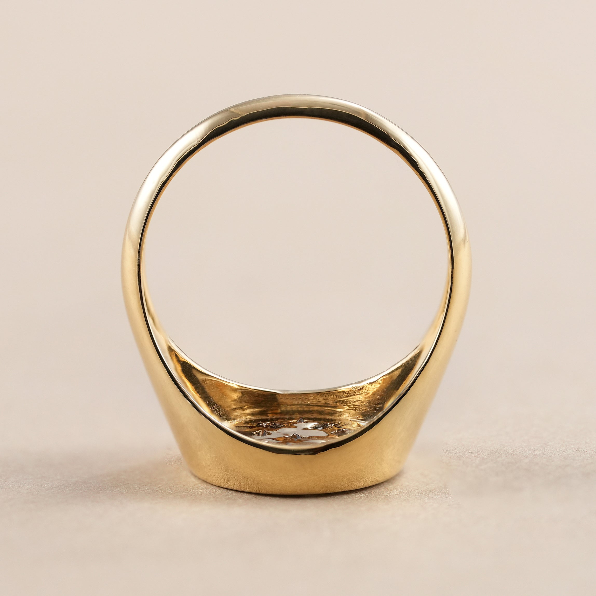 Handmade gold signet ring featuring princess and baguette diamonds