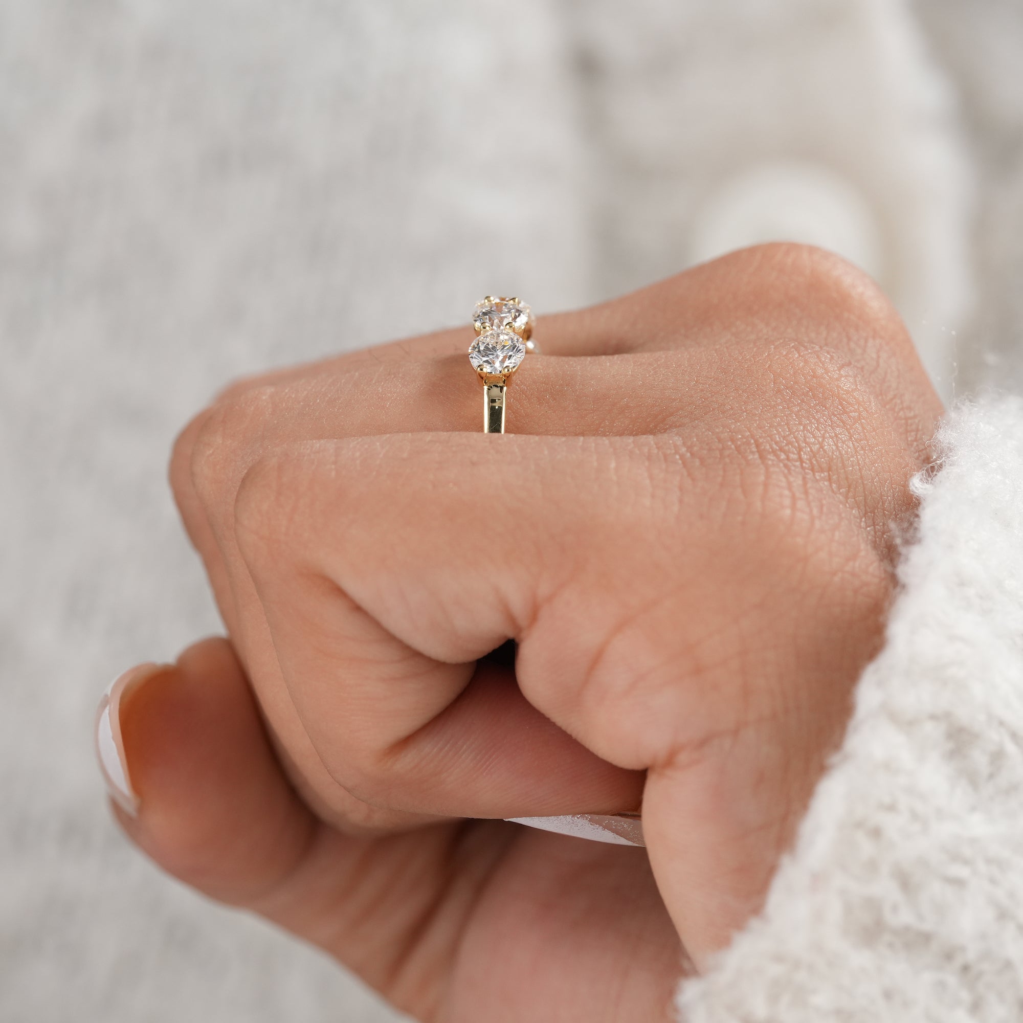 Gold five stone diamond wedding ring with brilliant sparkle.