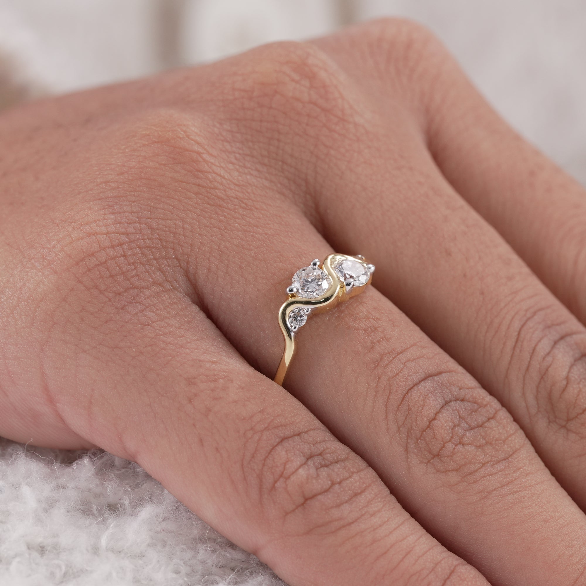 Bridal jewelry diamond ring in curved wave silhouette.