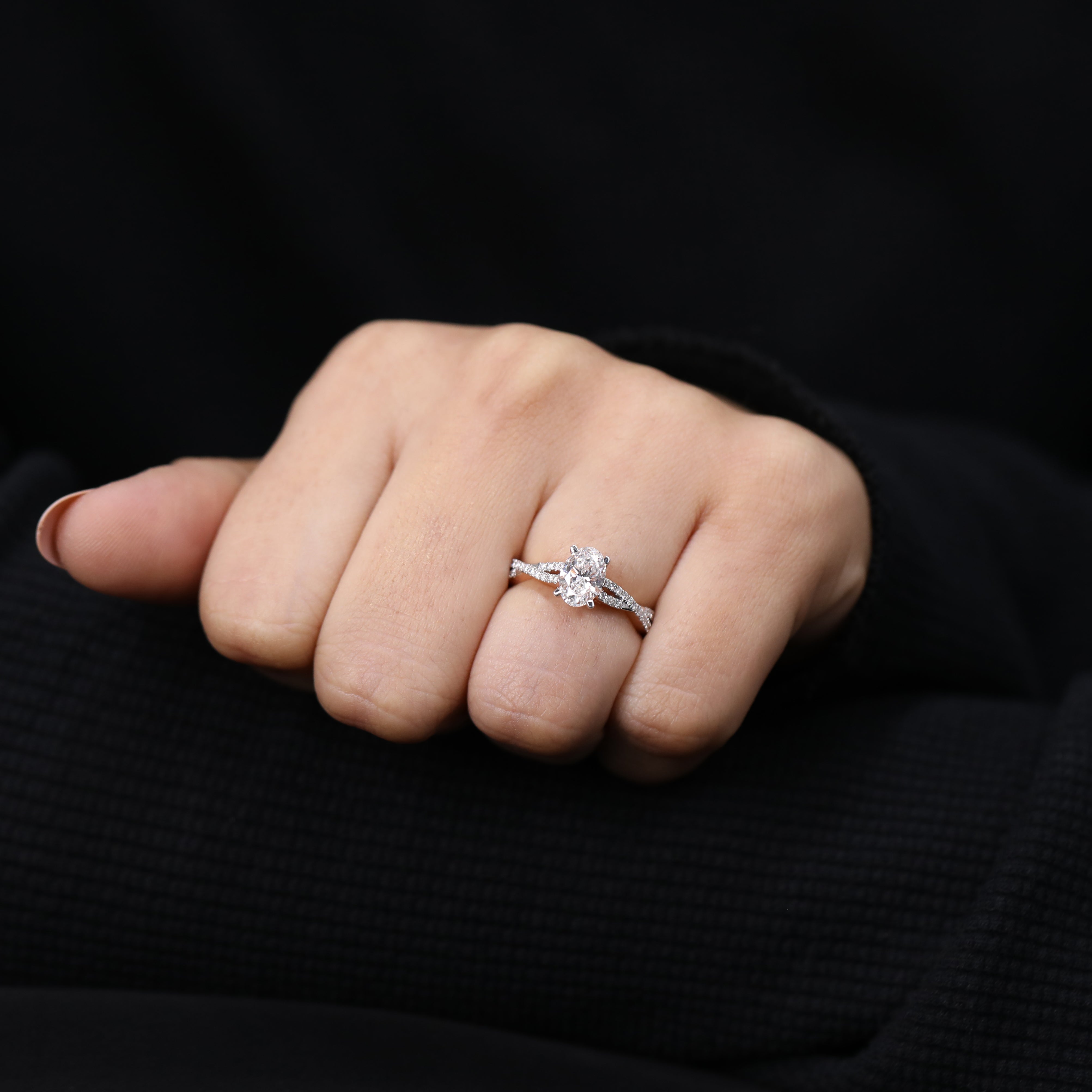 Bridal statement ring highlighting oval lab created diamond