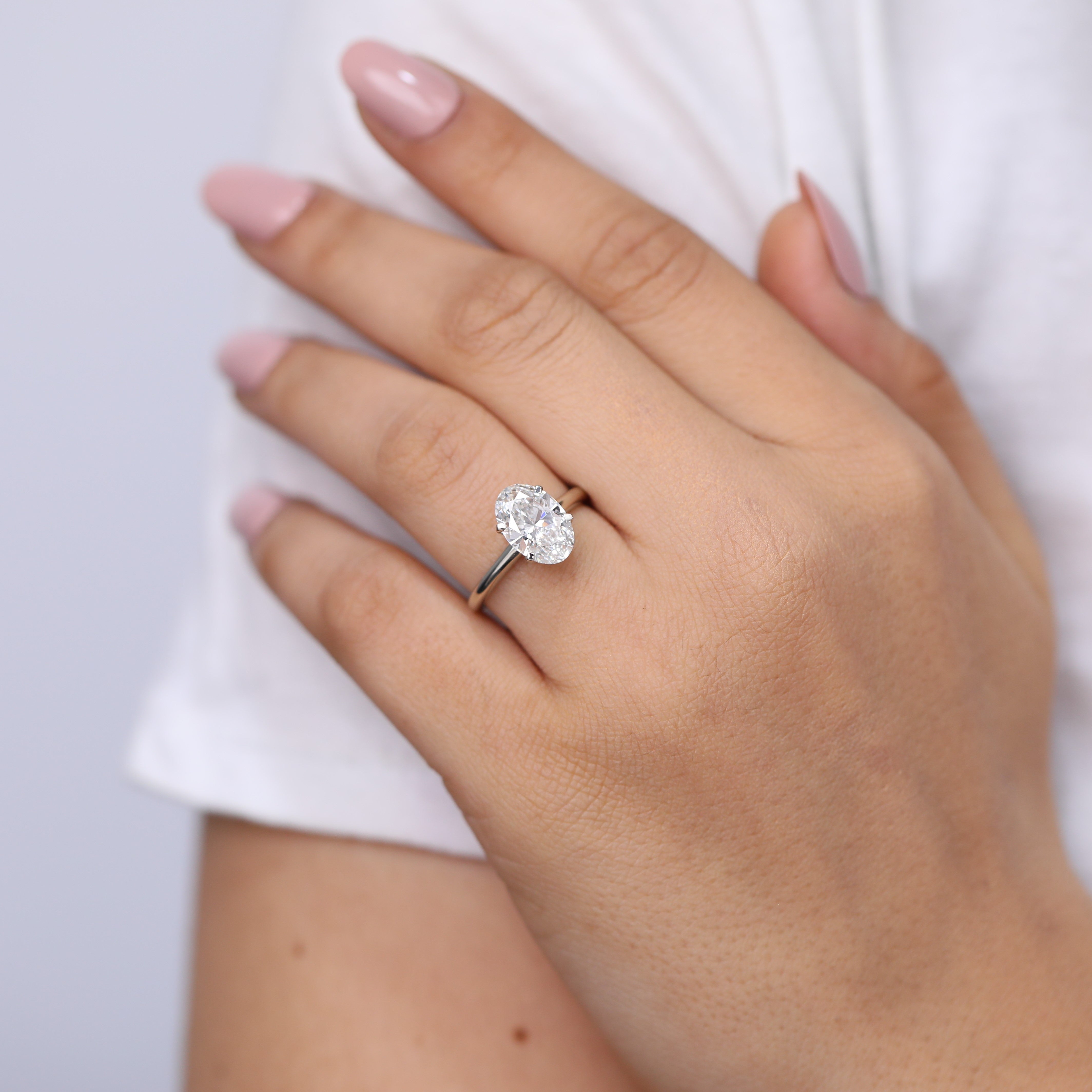 Oval diamond engagement ring lab grown in timeless solitaire style