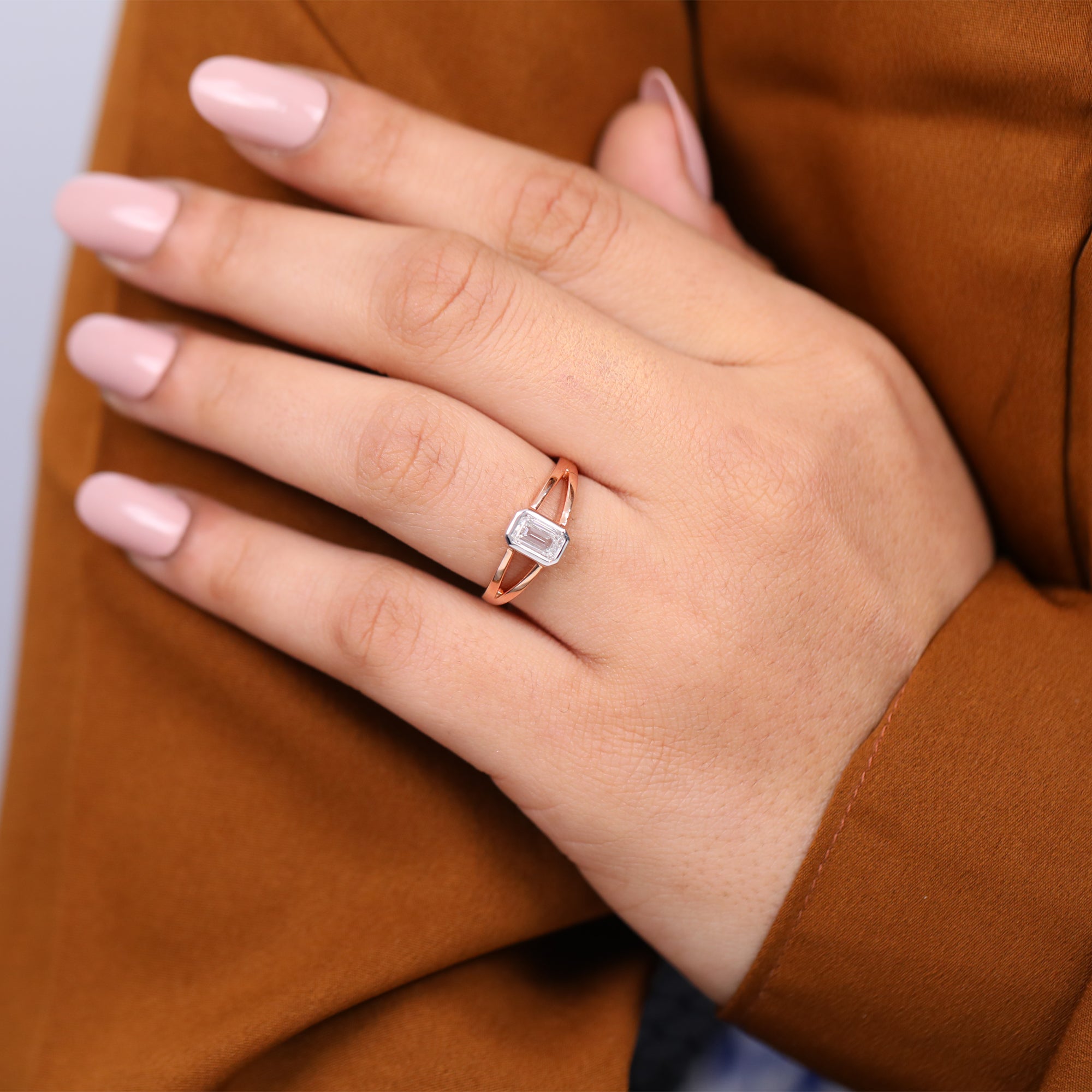 Minimalist emerald cut lab grown diamond engagement ring with split shank