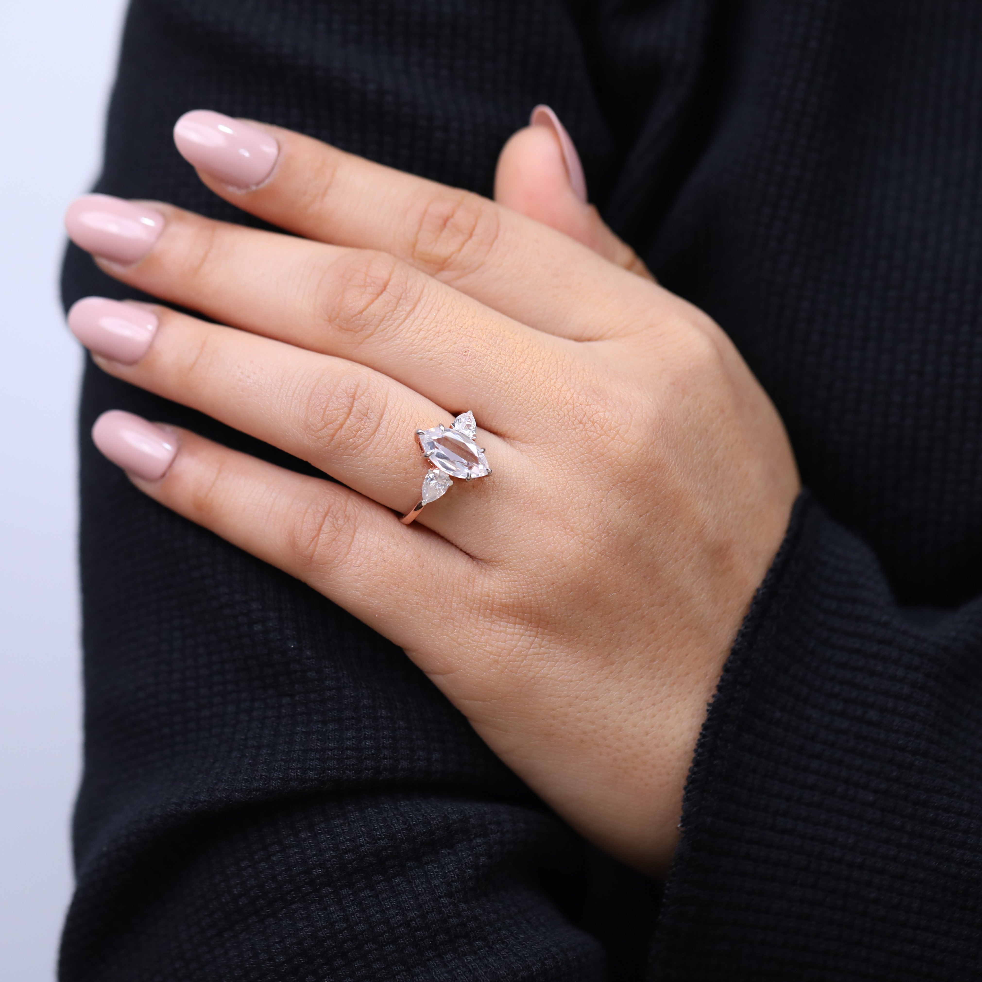 Timeless marquise cut gemstone ring with pear accents for proposal moment