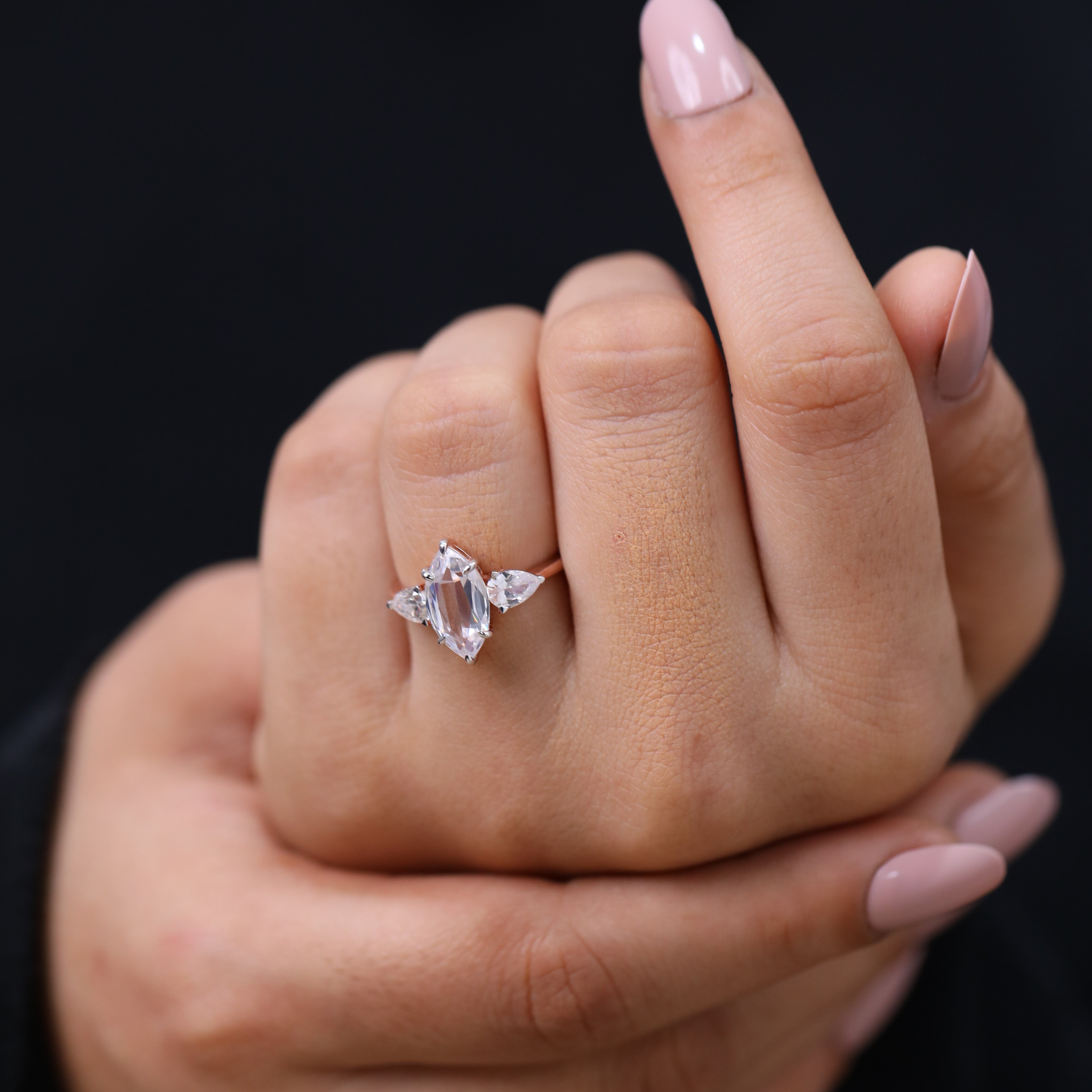Bridal ring with marquise center stone and pear side stones for engagement