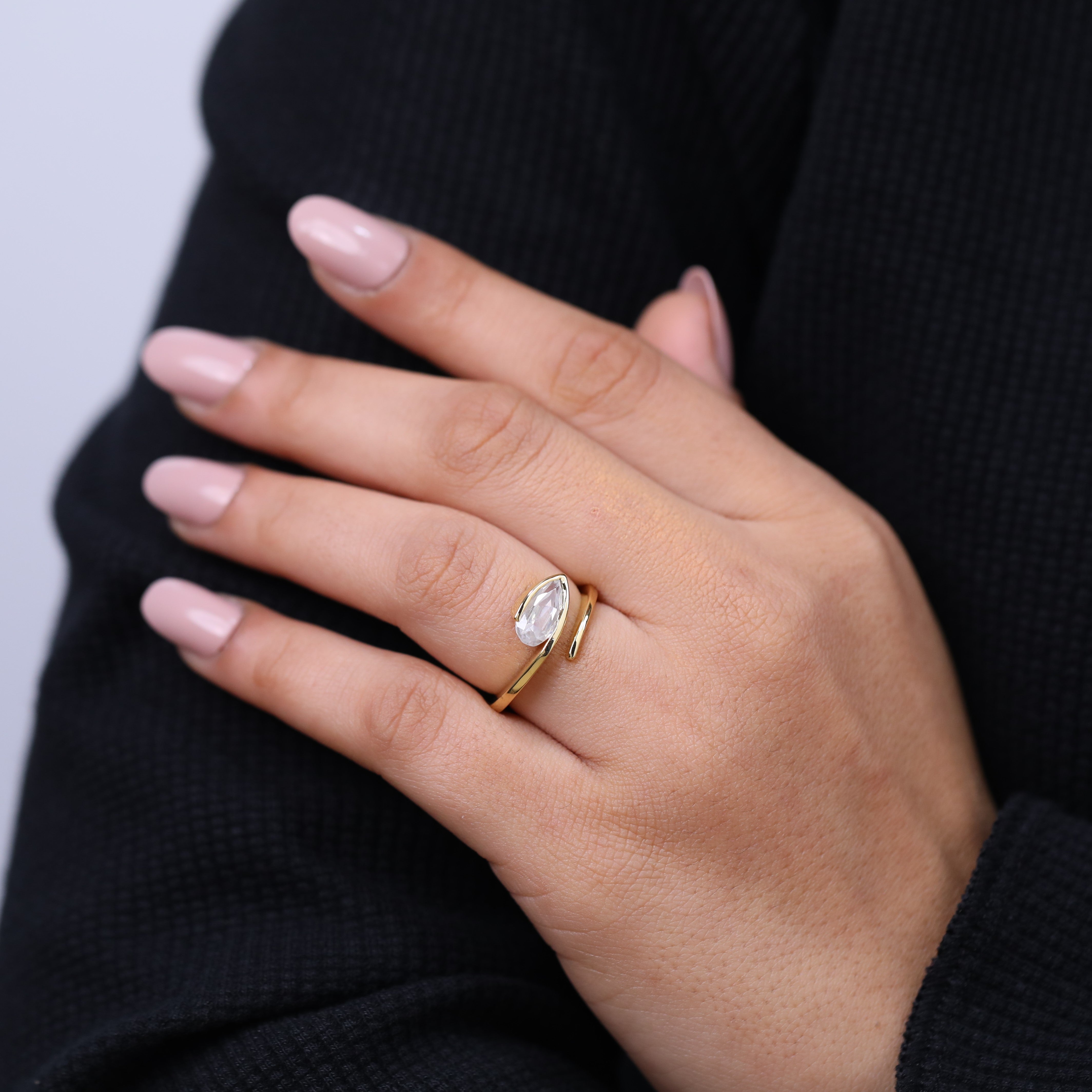 Unique Bezel set marquise solitaire diamond ring in bypass setting