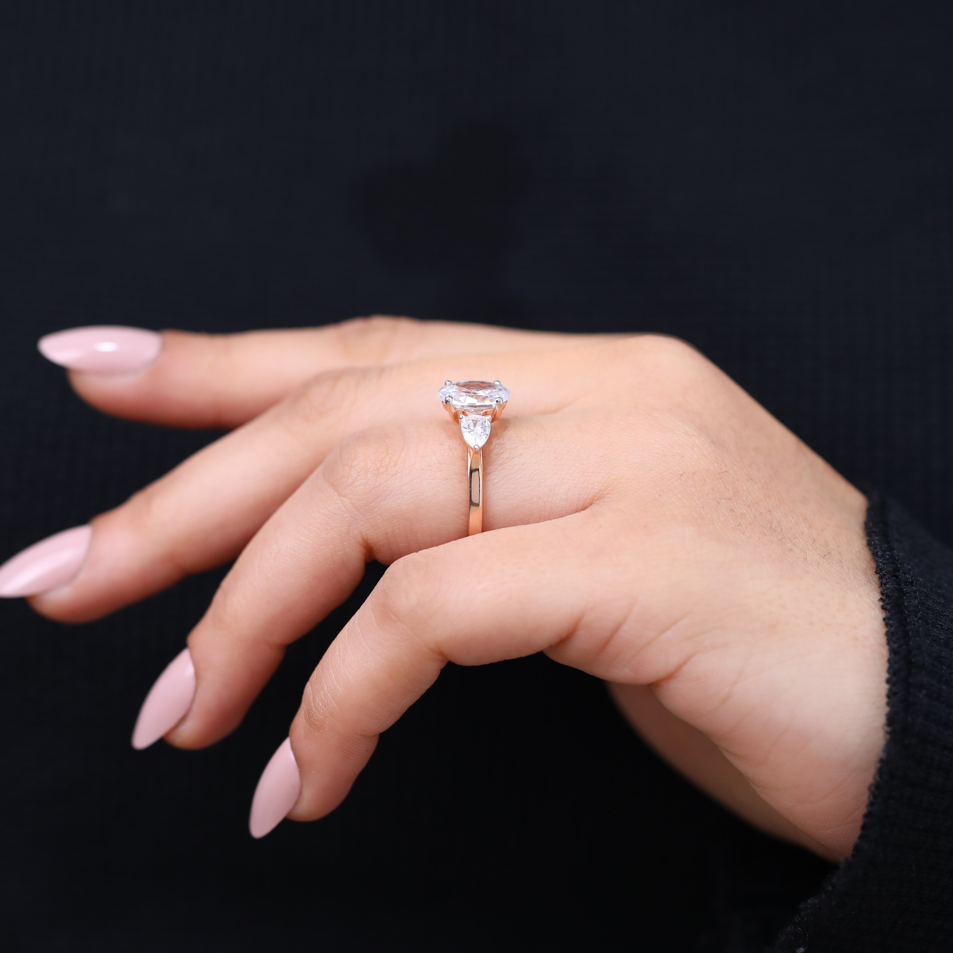 Oval shaped lab grown diamond engagement ring with pear sides