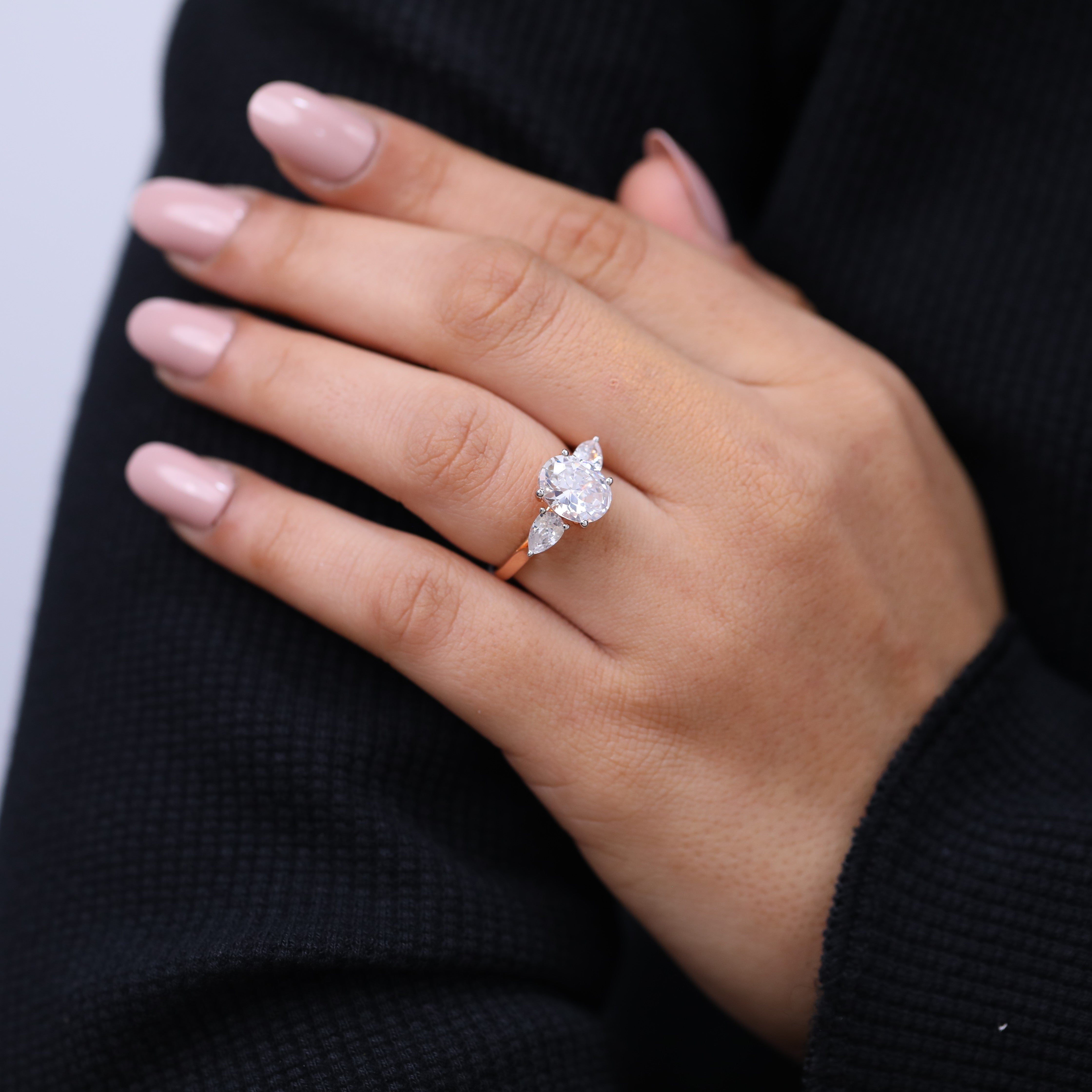 Women’s three stone lab diamond ring oval center pear accents