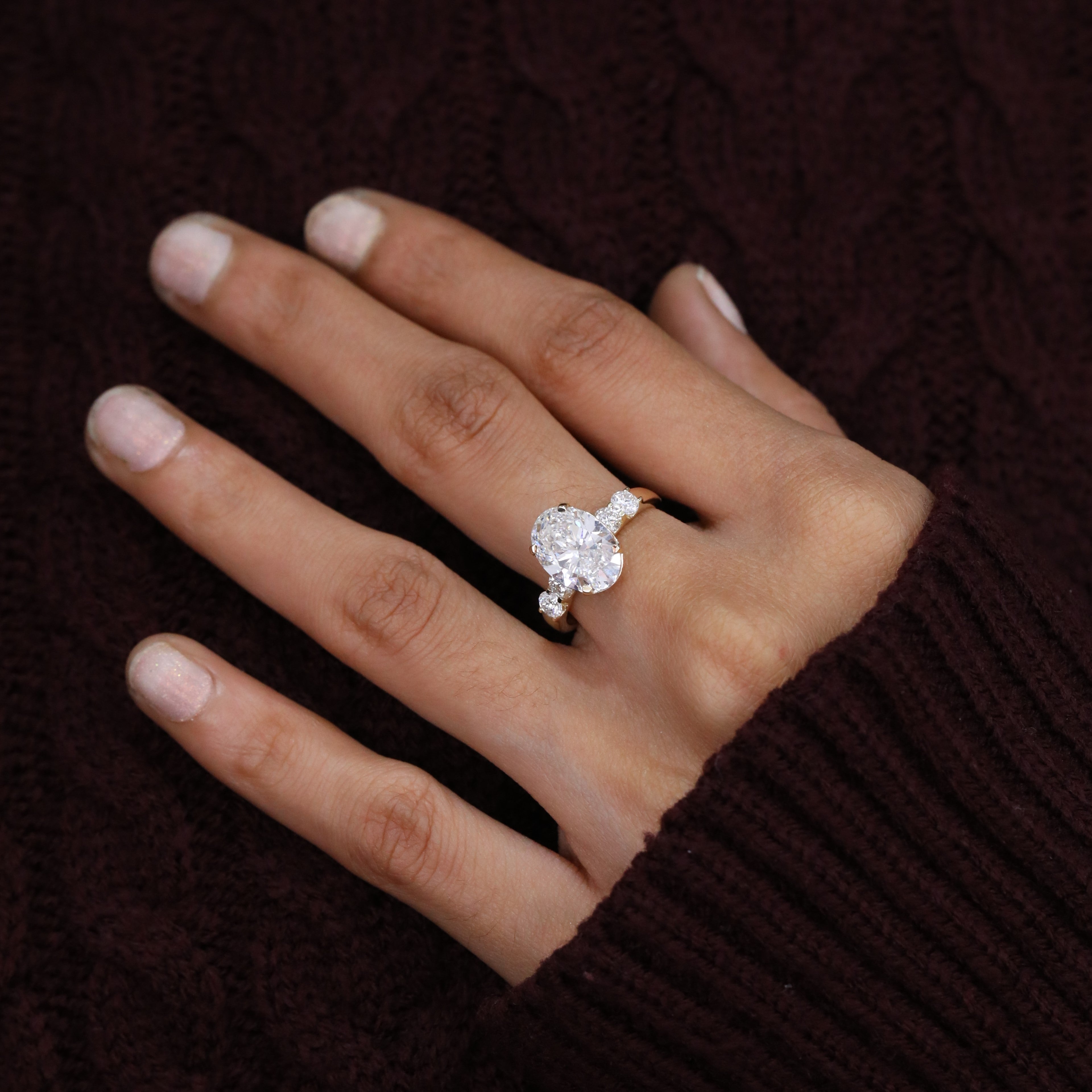Classic oval cut lab diamond engagement ring with round side stone