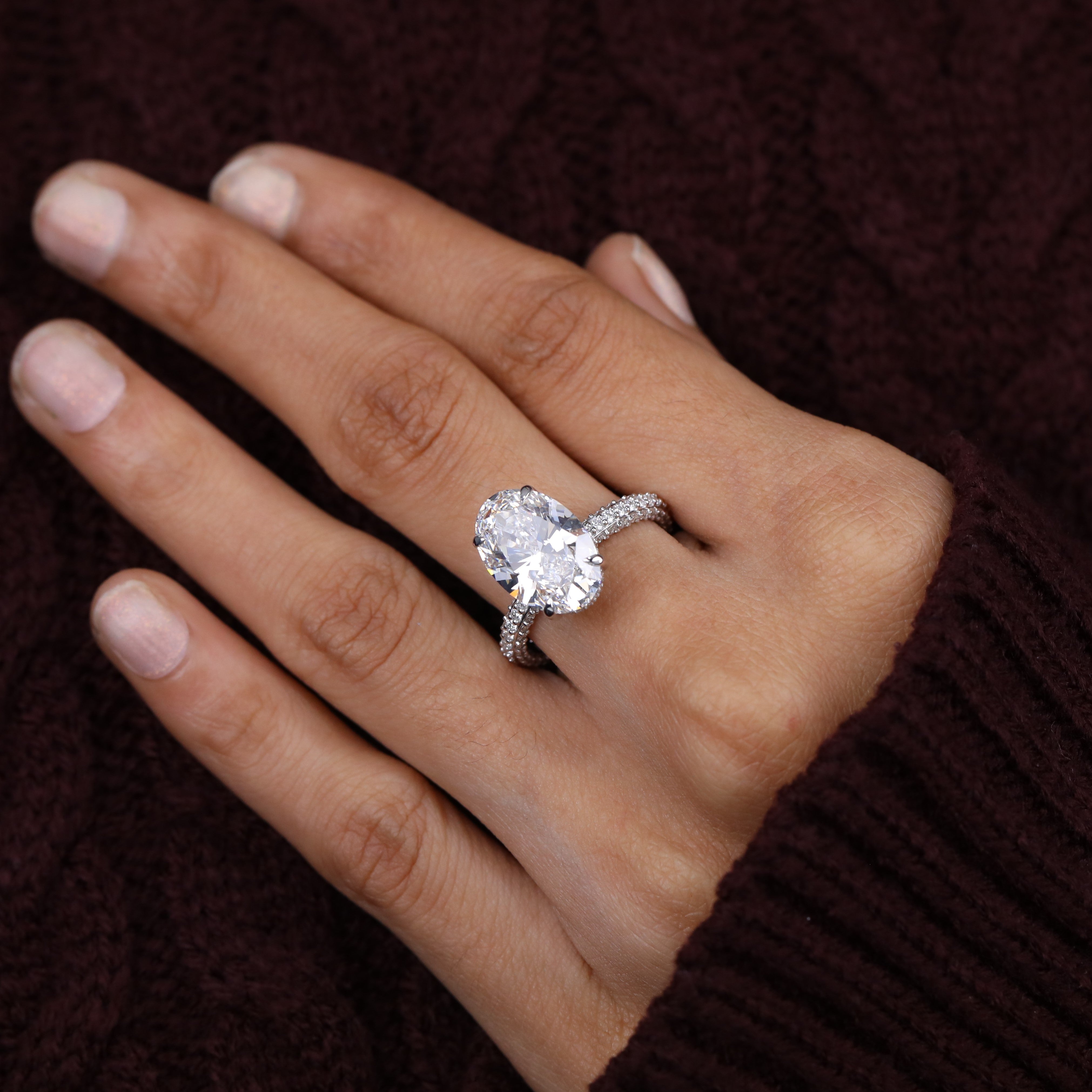 Stylish oval lab grown diamond ring designed with a slim pavé shank