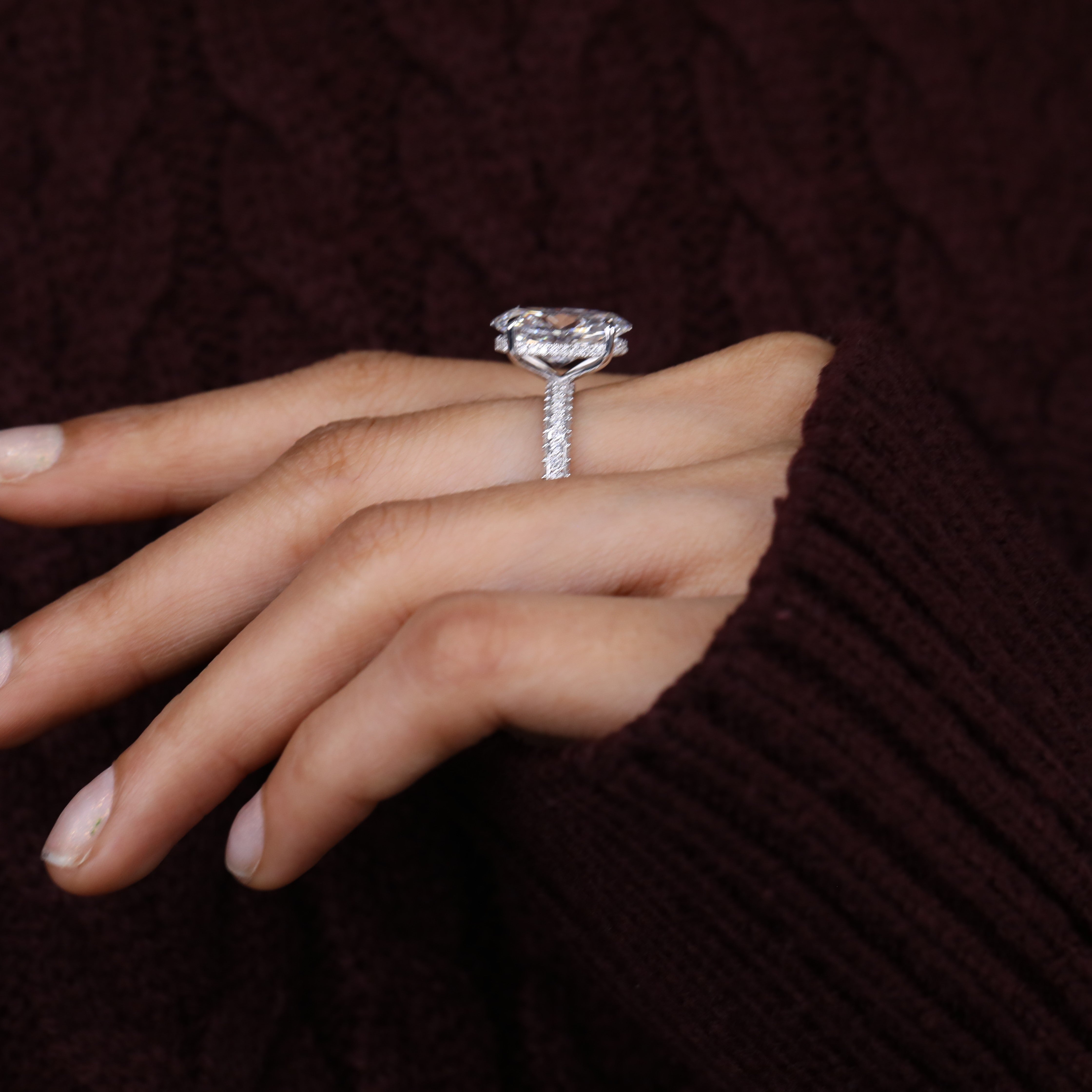 Timeless oval lab grown diamond ring offering elegant sparkle with pavé band