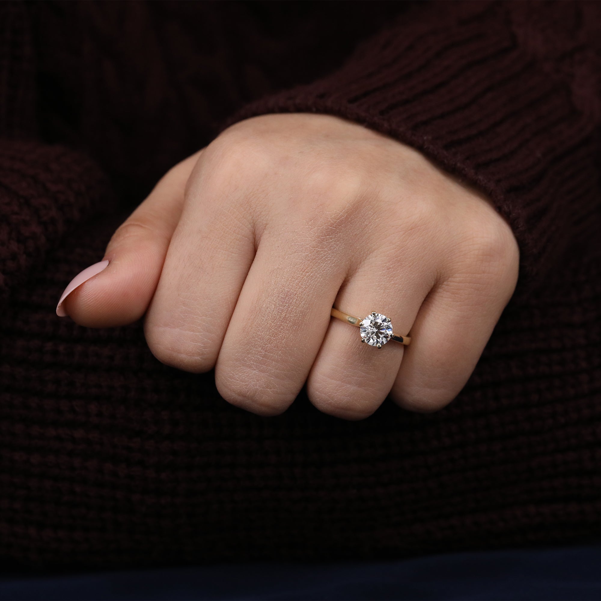 Simple and elegant solitaire ring featuring a sparkling round lab diamond