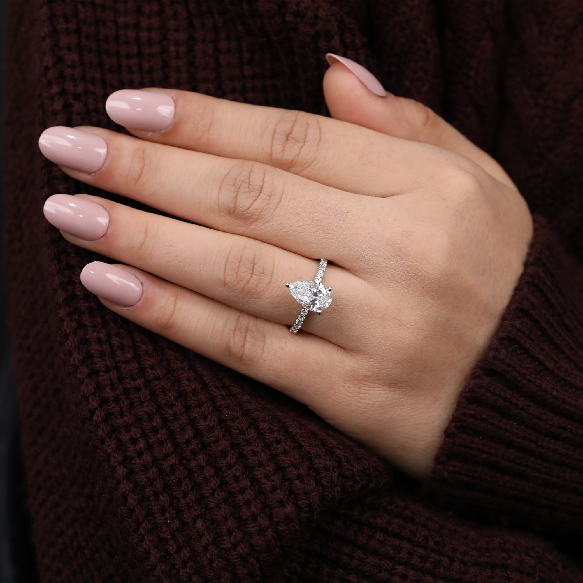 Modern pear-shaped lab diamond ring with shimmering side lab diamonds