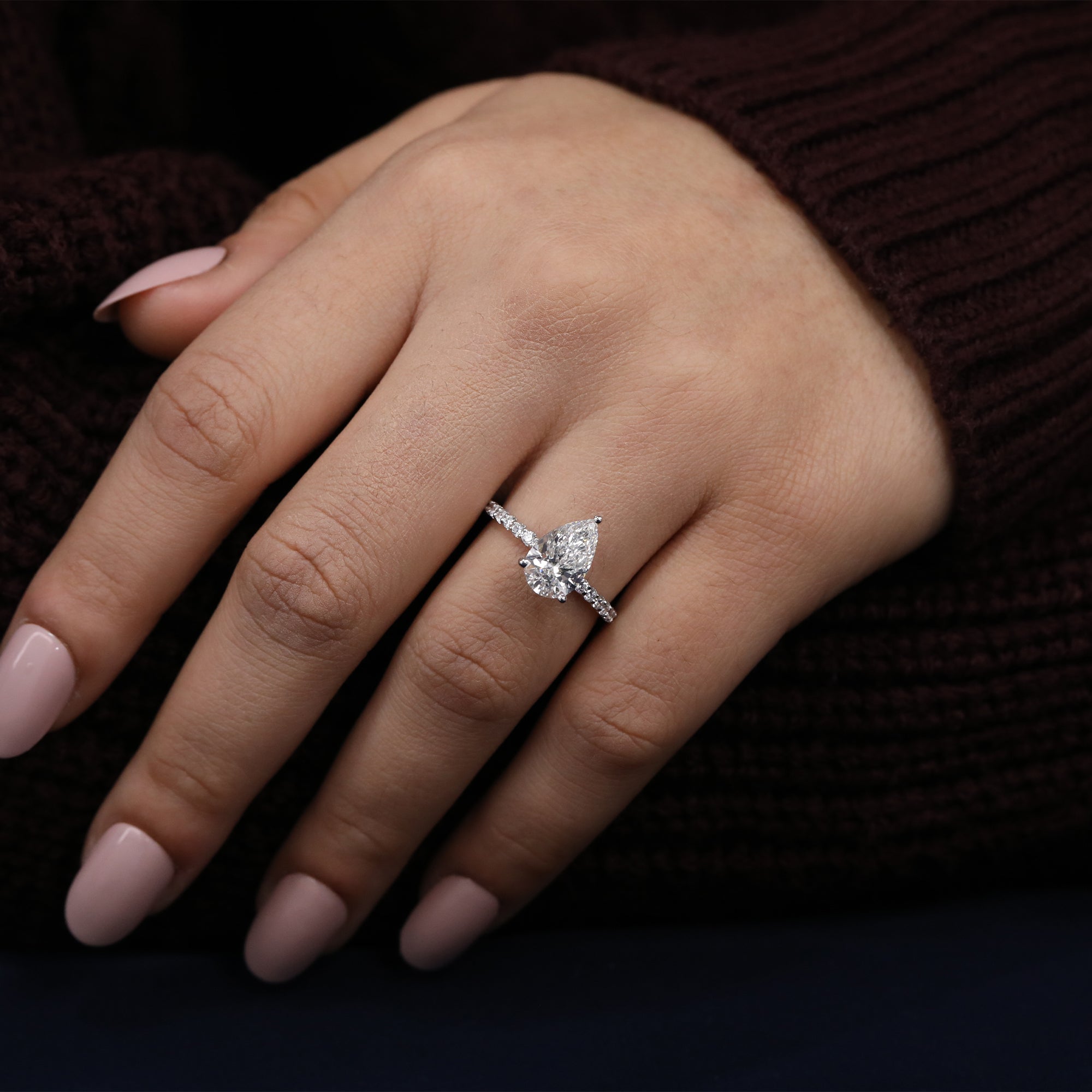 Statement pear lab diamond ring with a band lined in small lab diamonds