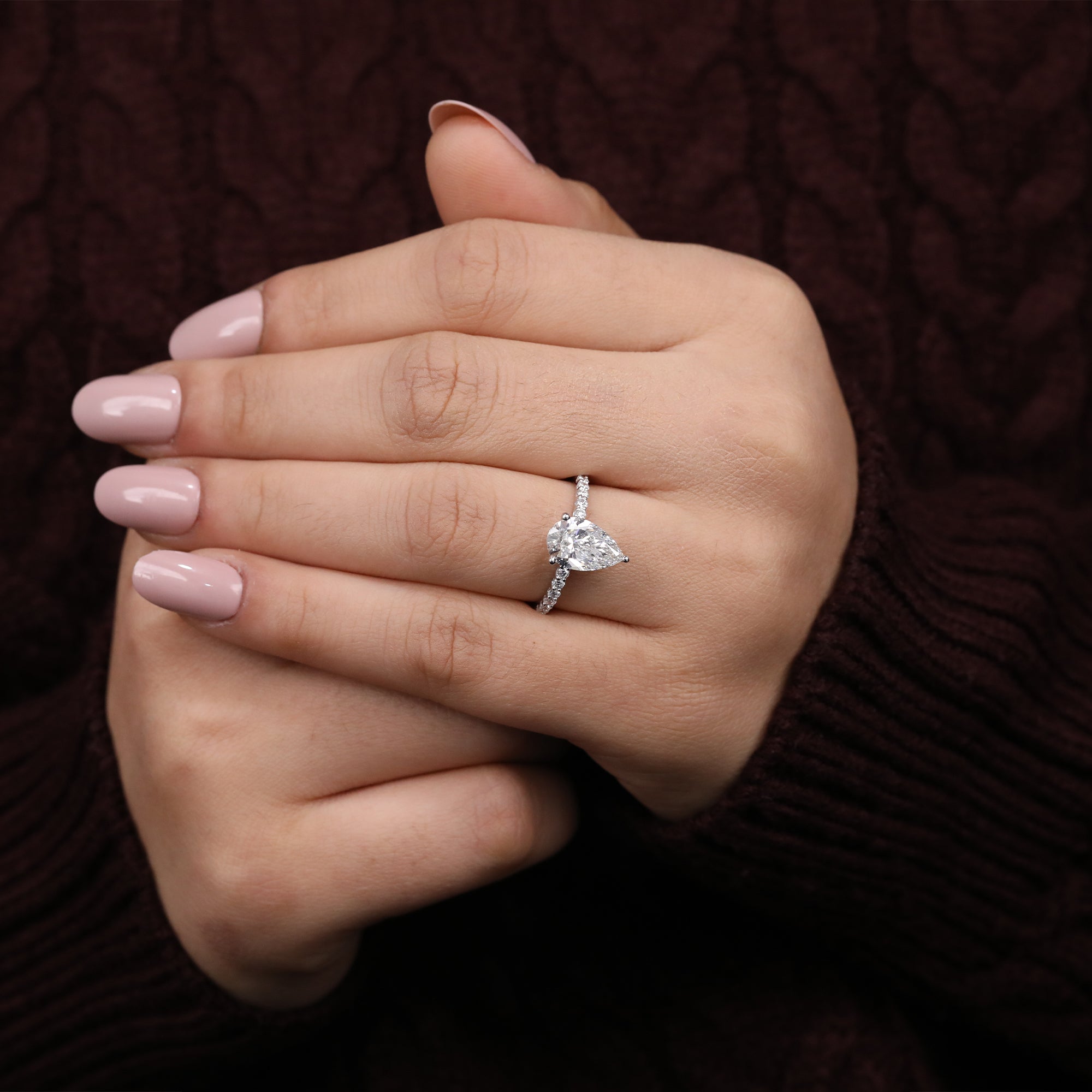 Luxury pear-cut lab diamond ring paired with a diamond pavé band