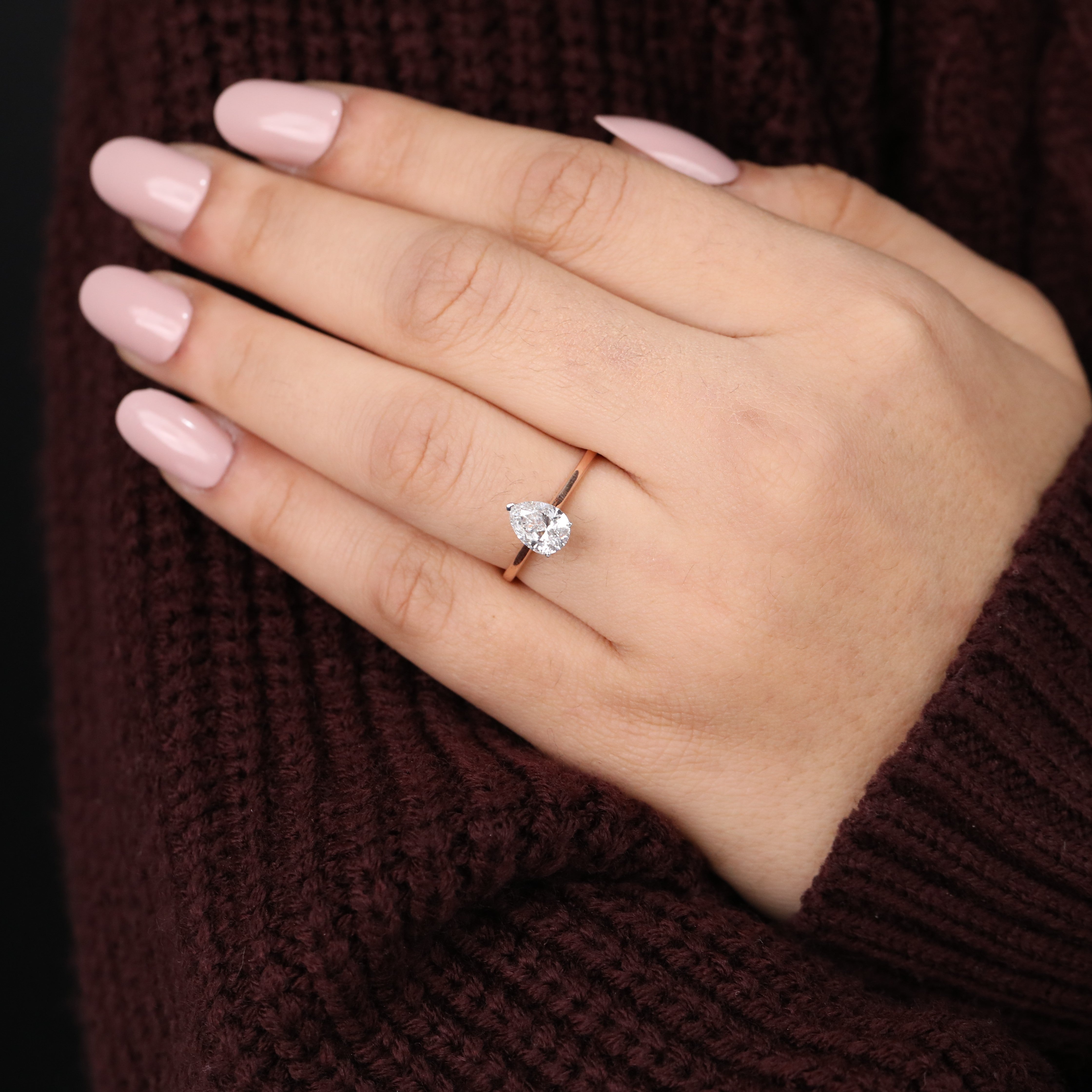 Timeless pear lab grown diamond ring crafted with a thin solitaire band.