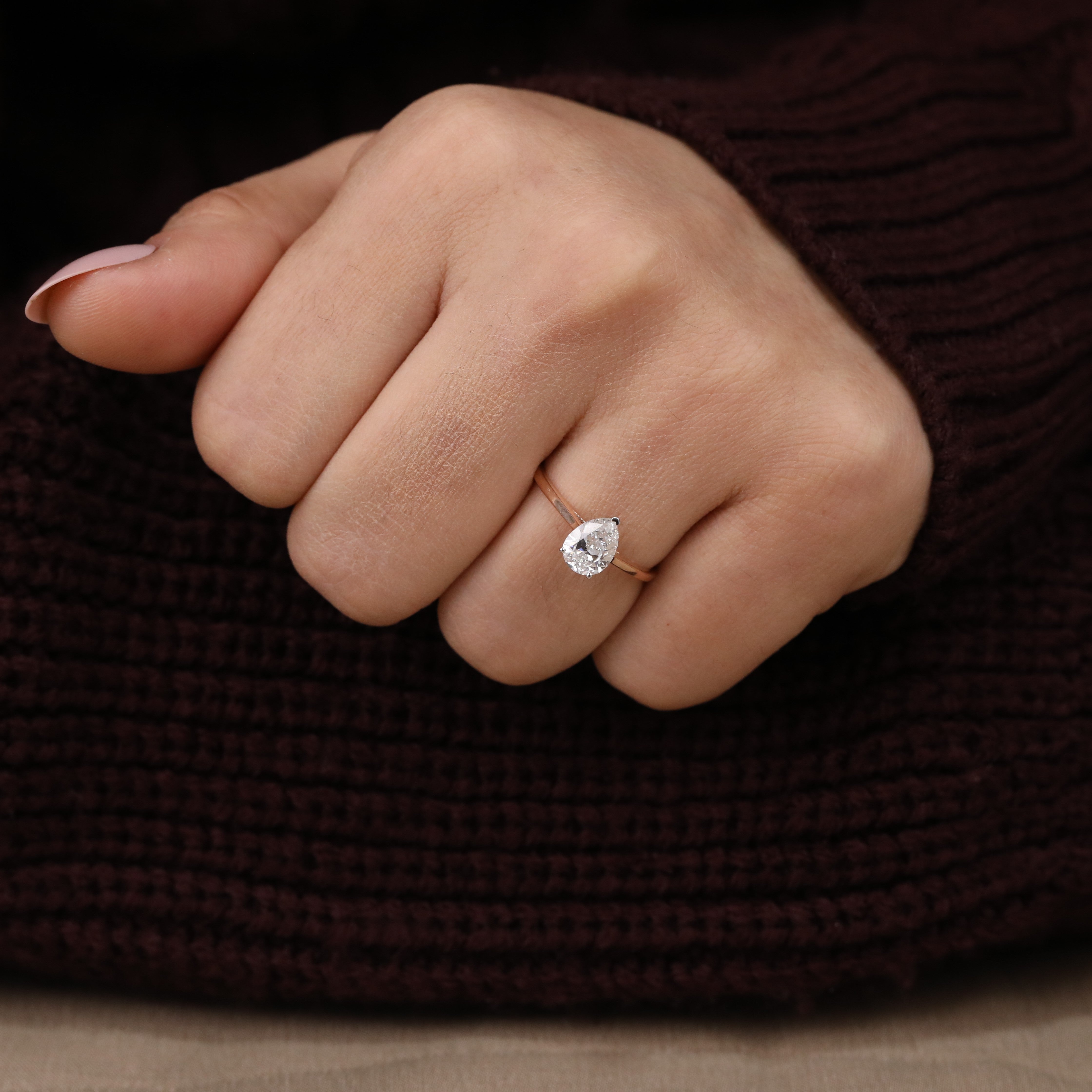 Modern pear solitaire ring showcasing an ethical lab grown diamond centerpiece.