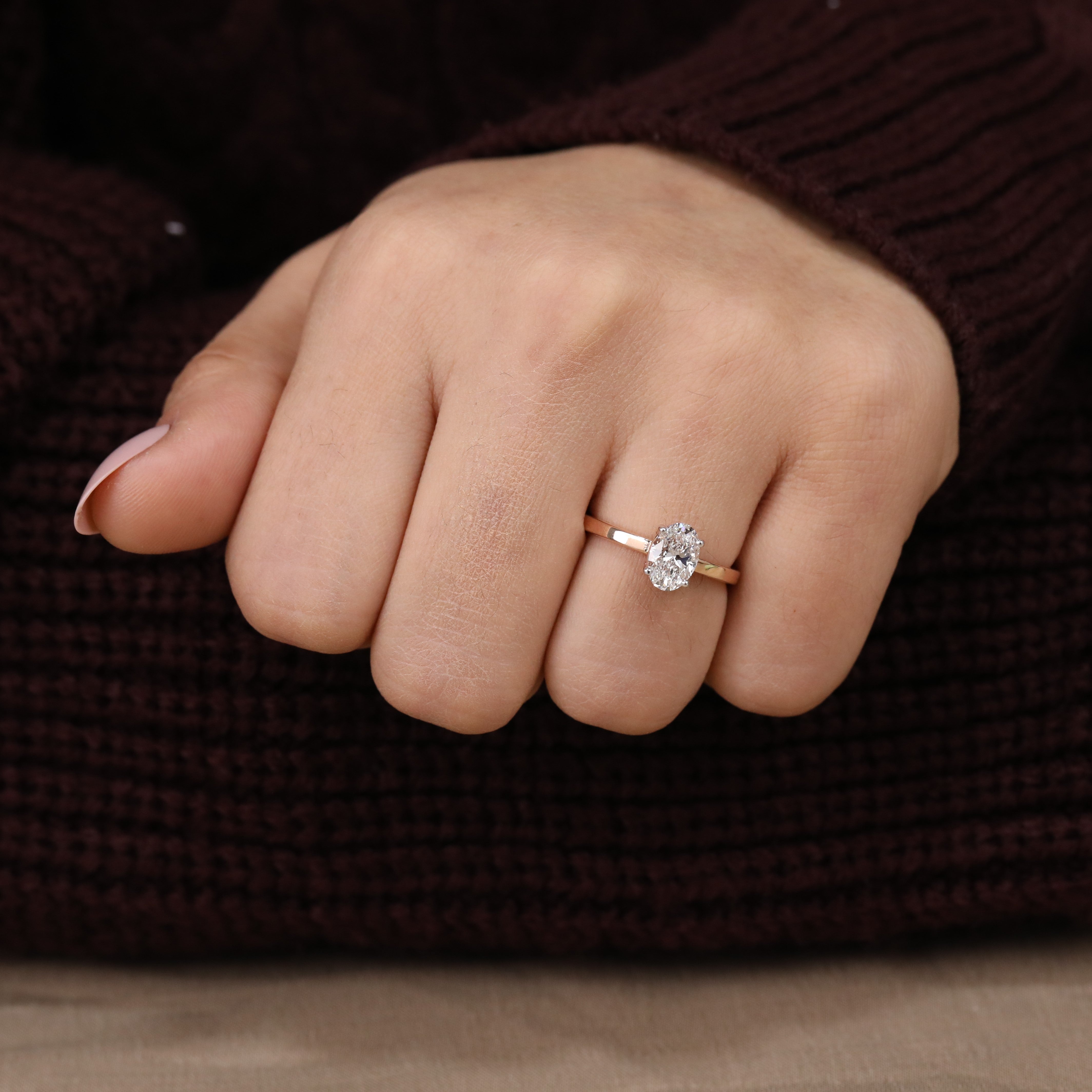 Refined engagement ring showcasing a bright oval lab grown diamond centerpiece