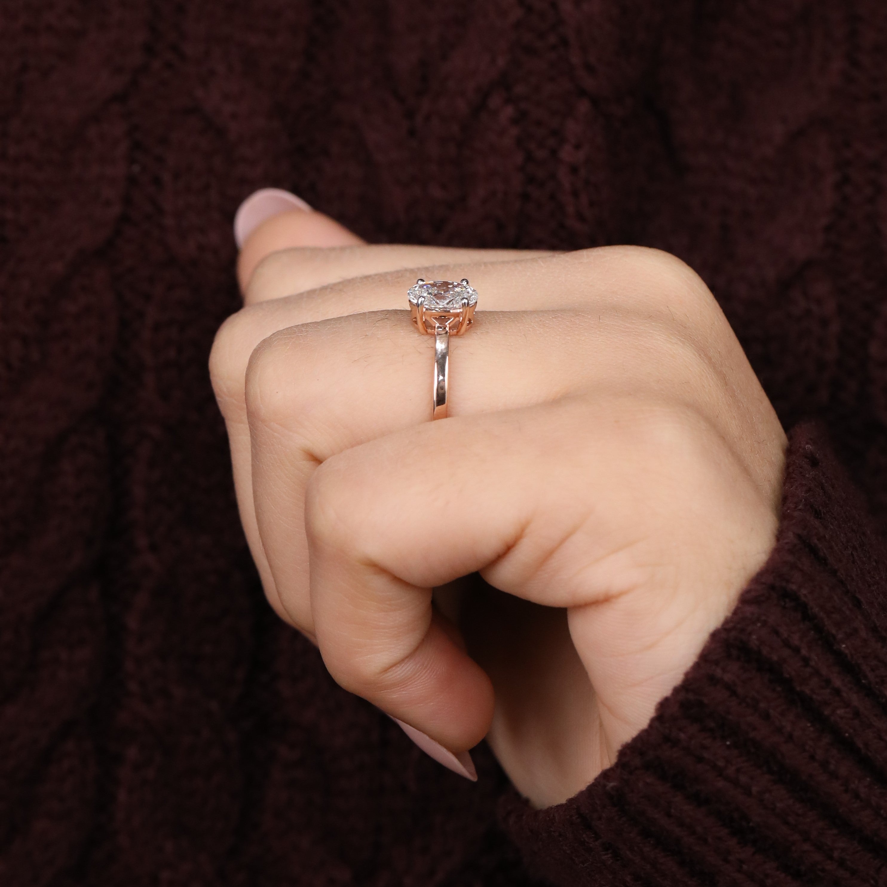 Sleek band ring featuring a brilliant oval lab grown diamond center stone