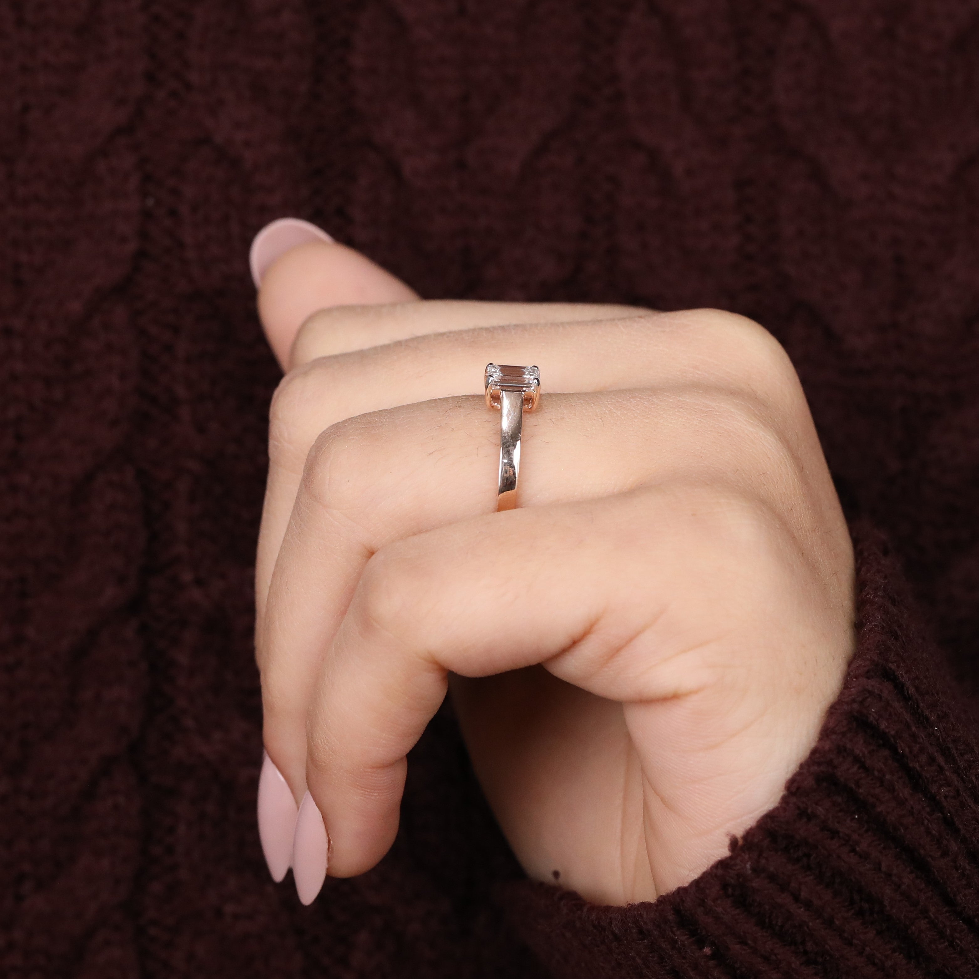 Refined engagement ring featuring a sleek emerald-cut lab-grown diamond design.