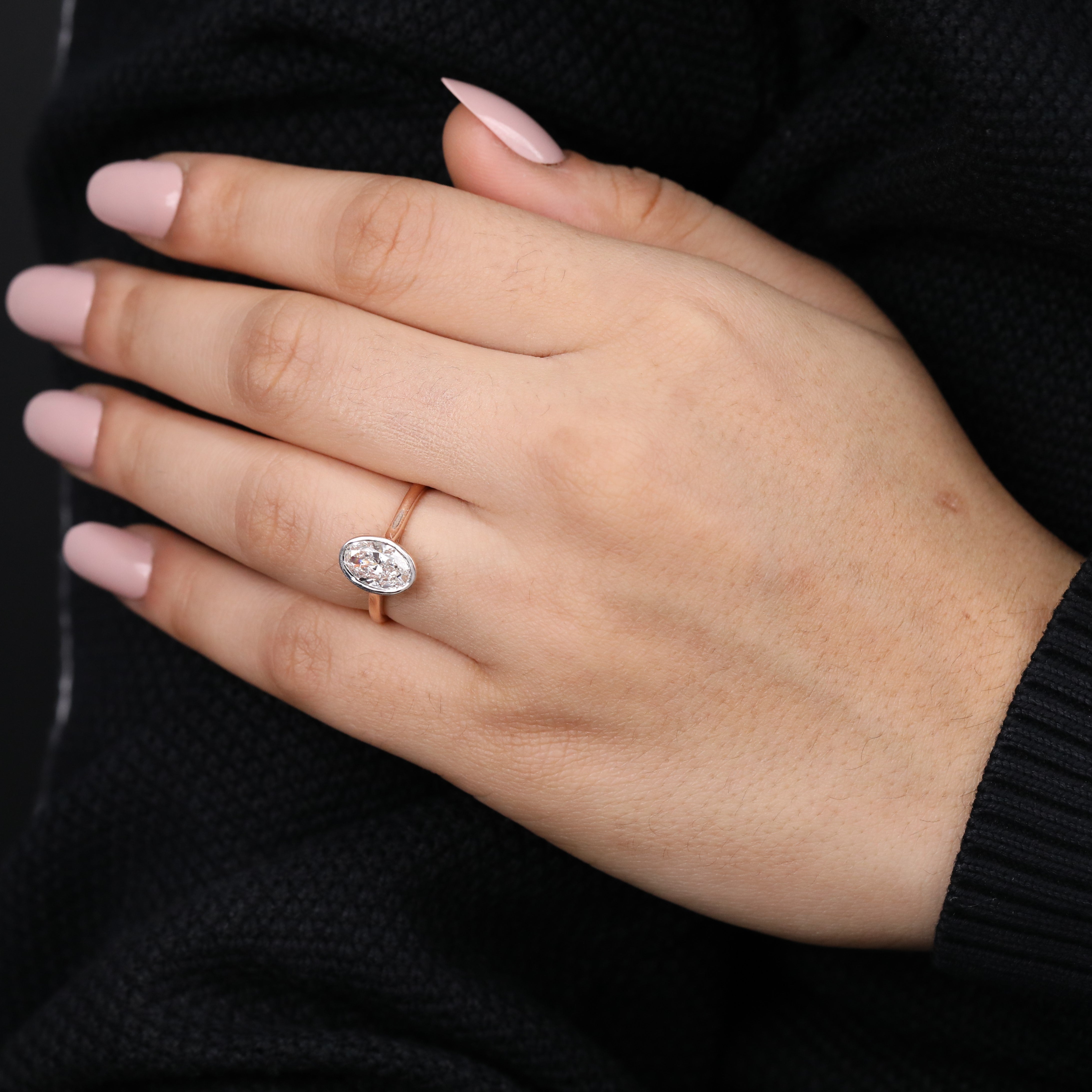 Elegant oval lab grown diamond ring offering sleek bezel design for proposals