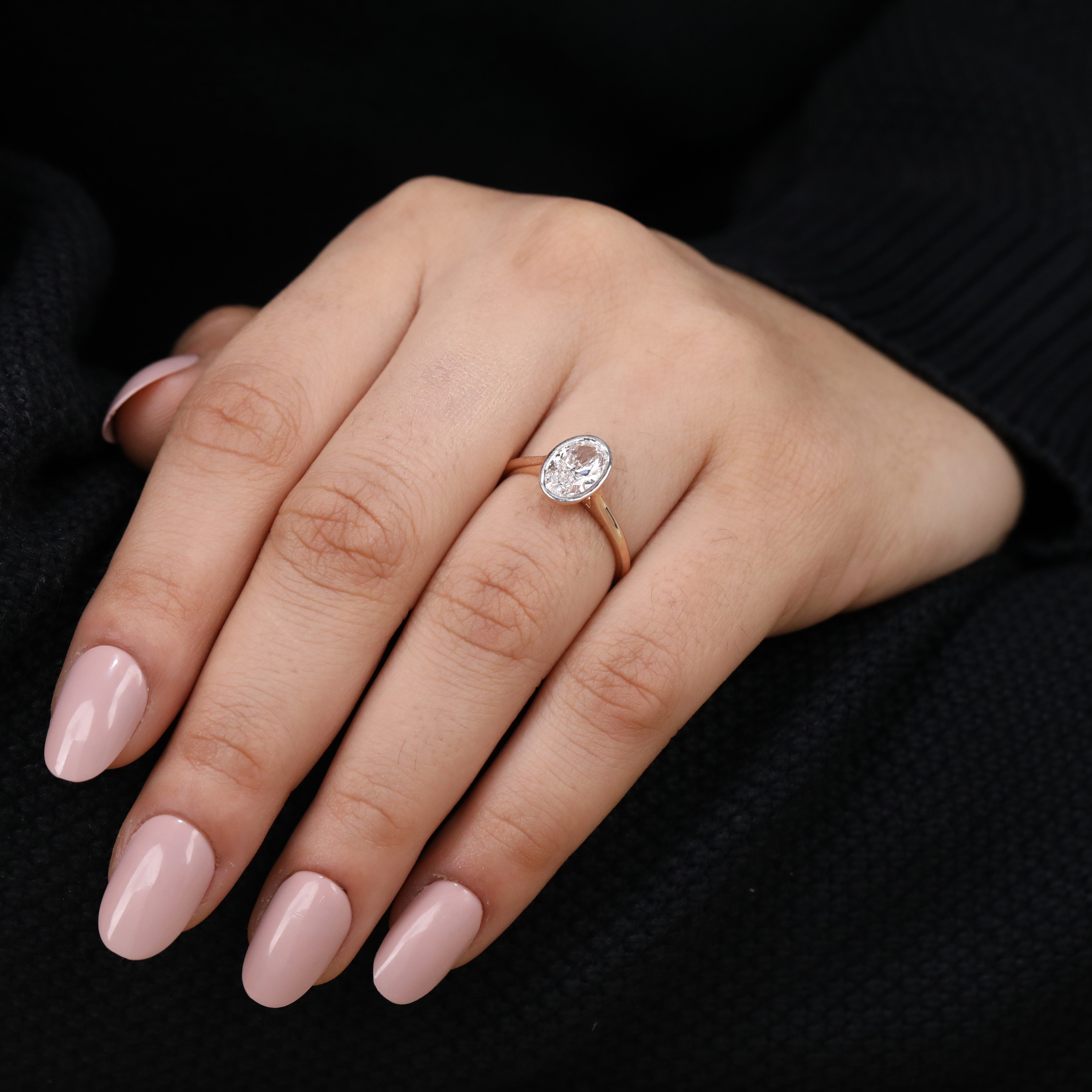 Romantic bezel set oval lab grown diamond engagement ring with minimalist style